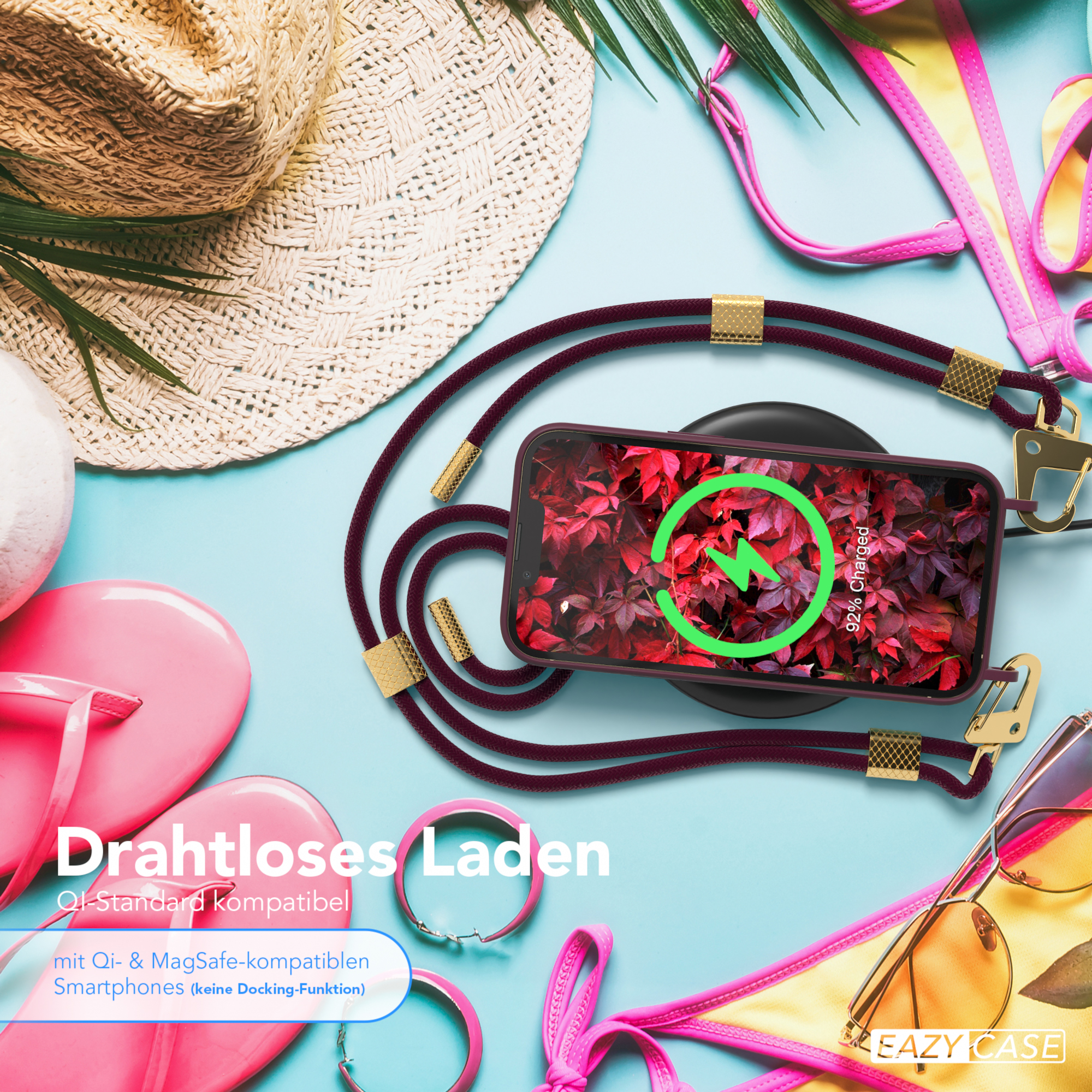 Telefon lädt drahtlos auf einem Ladegerät. Die Szene umfasst Sonnenbrillen, einen Hut und einen Bikini auf blauer Oberfläche.