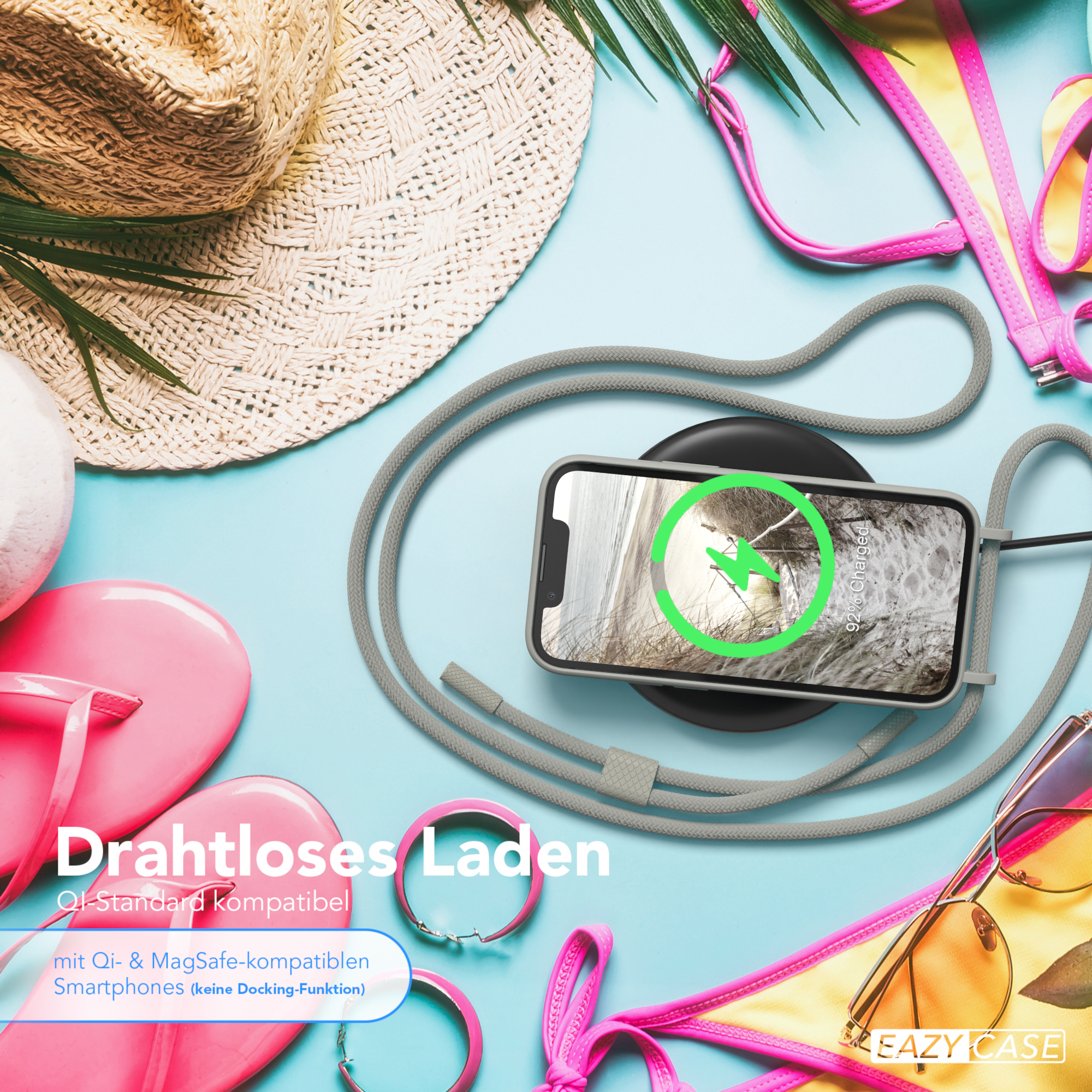 Telefon lädt auf einem Pad, mit Sommeraccessoires. Text auf Deutsch: Kabelloses Laden, Qi-Standard kompatibel.