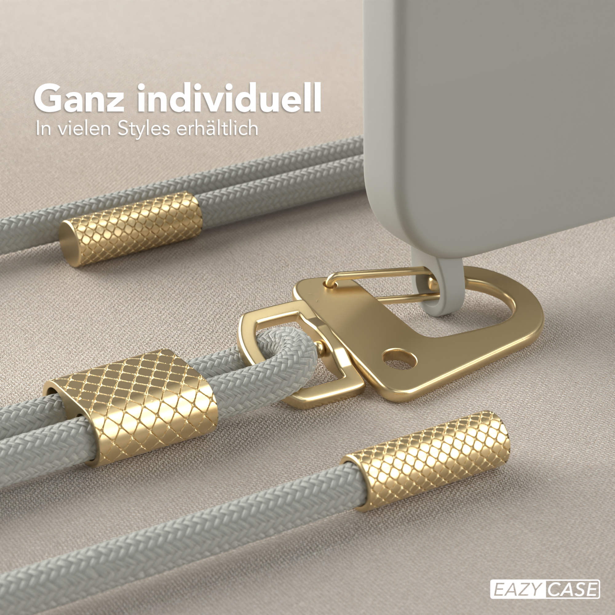 Nahaufnahme einer Handyhülle mit goldenen Details und einem grauen Seil.