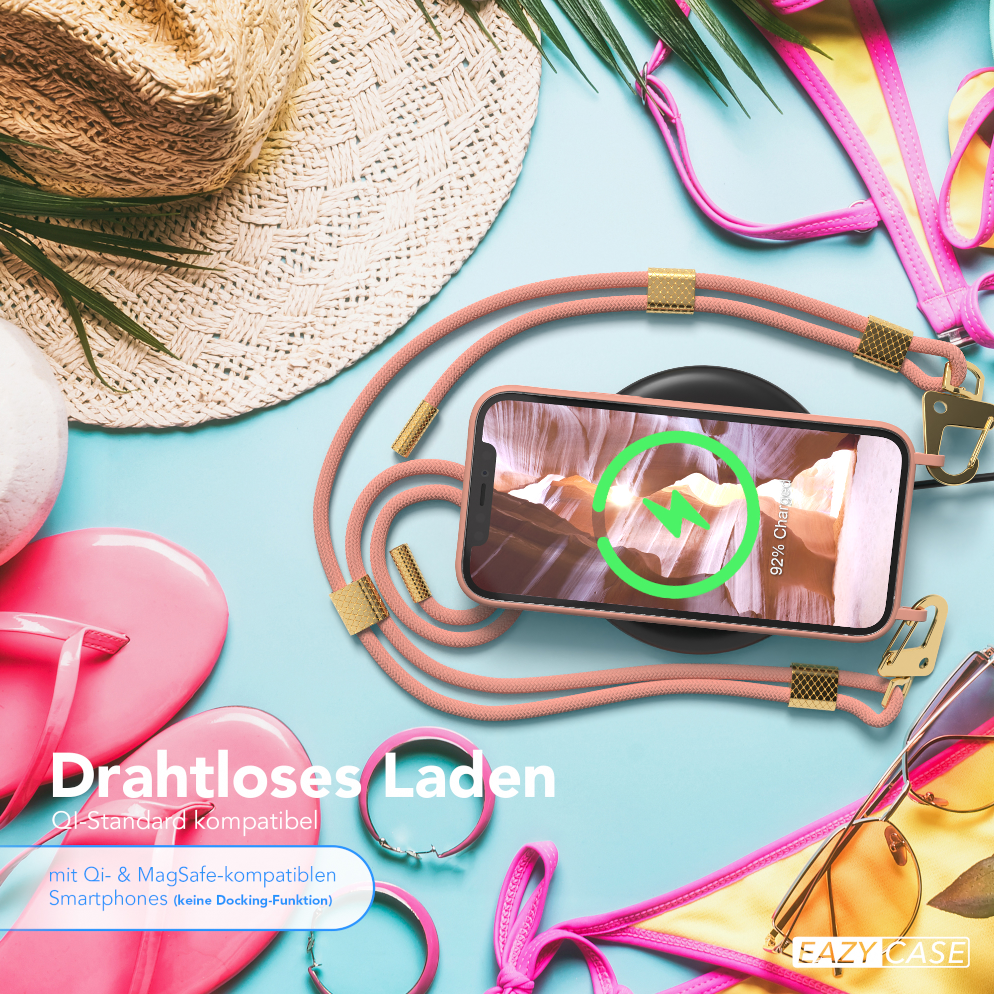 Telefon, das auf einem kabellosen Ladegerät geladen wird, mit Strandaccessoires im Hintergrund.