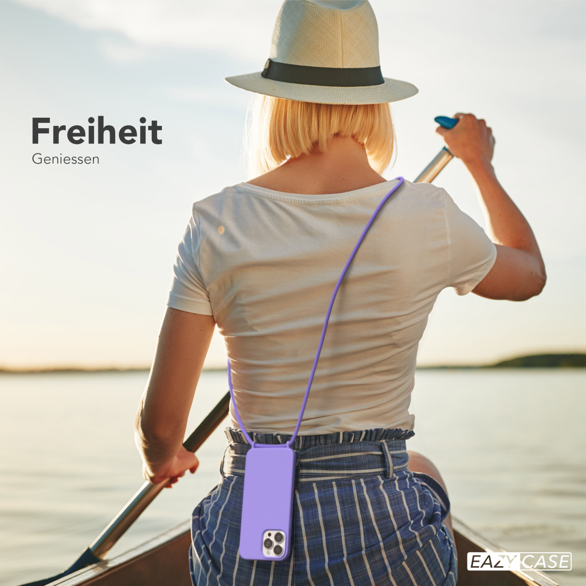 Frau im Hut rudert ein Boot mit Handyhülle. Text: Freiheit.