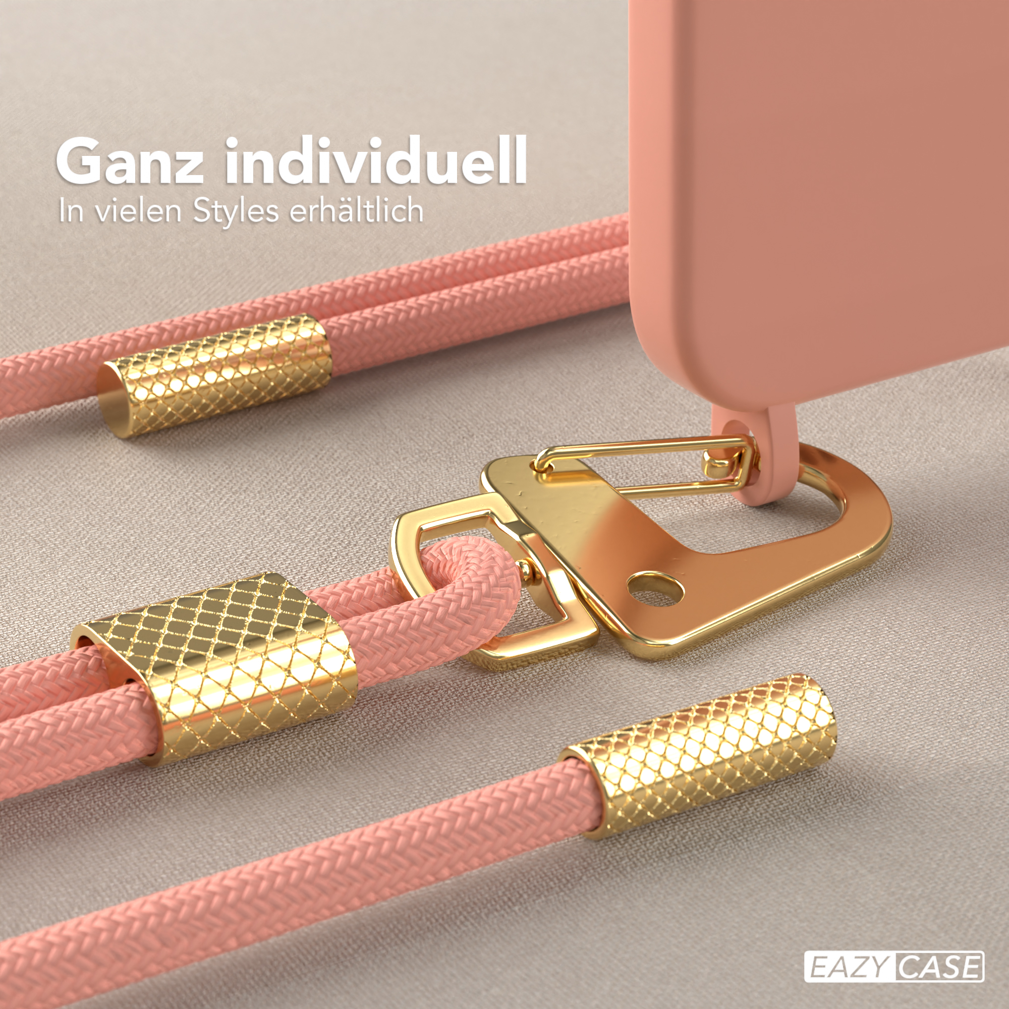Nahaufnahme einer rosa Handyhülle mit goldenen Details, einschließlich eines Schlüsselbandhakens.