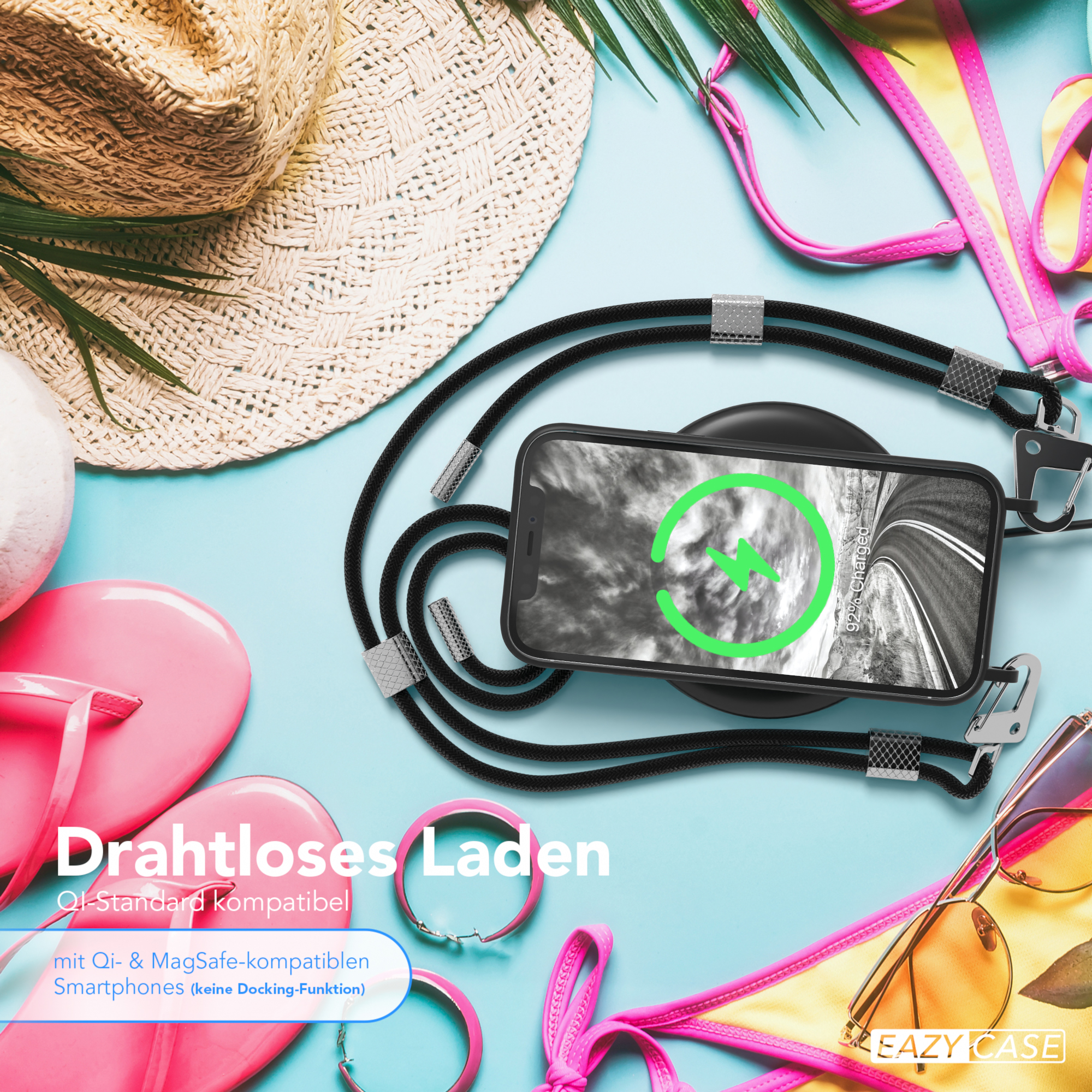 Ein Telefon auf einem kabellosen Ladegerät. Es gibt Sonnenbrillen und rosa Accessoires darum herum.