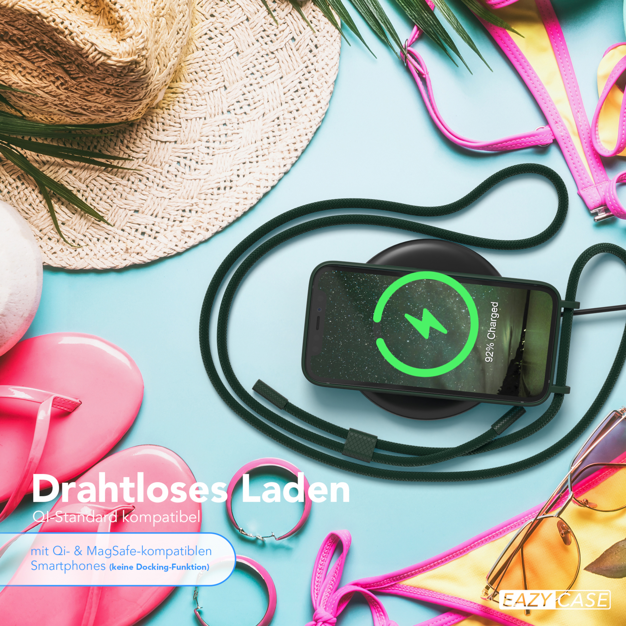 Ein Telefon, das auf einem kabellosen Ladegerät geladen wird. Weitere Gegenstände sind Hut, Sonnenbrille und Bikini-Oberteil.