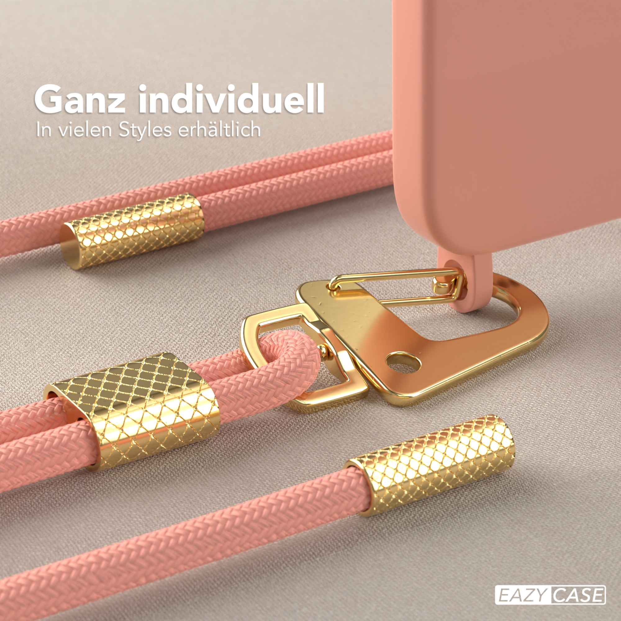 Nahaufnahme einer Handyhülle mit pinkfarbenem Kordel und goldfarbener Hardware.