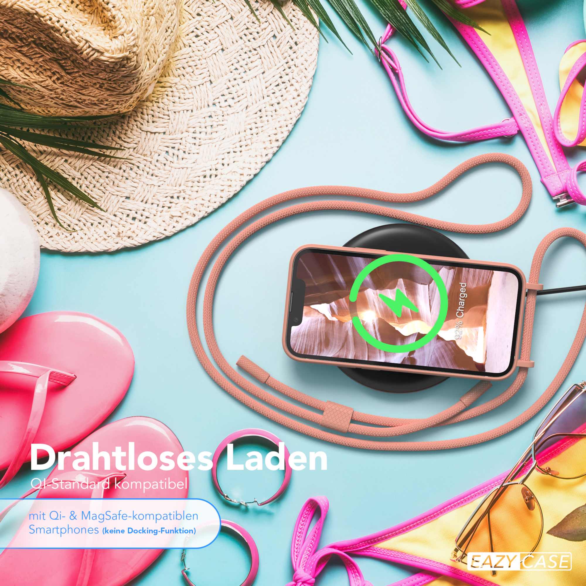 Telefon auf kabellosem Ladegerät, umgeben von Strandaccessoires: Hut, Flip-Flops, Sonnenbrille.