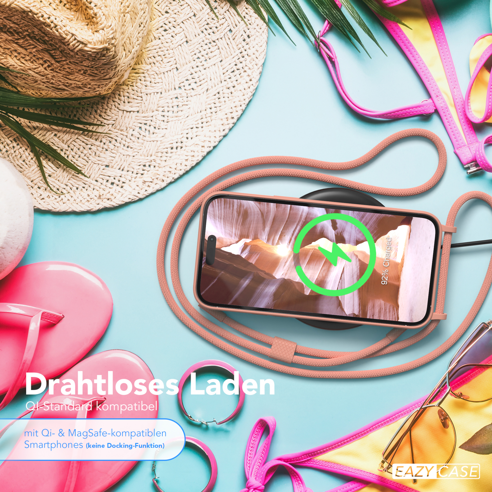 Ein Telefon mit Lanyard, Sonnenbrille und Strandutensilien.