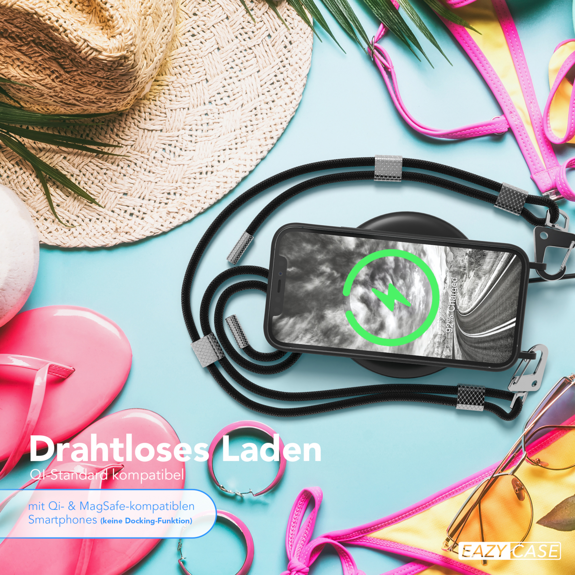 Telefon mit Ladesymbol, kabelloses Laden, Strandthema und Zubehör.