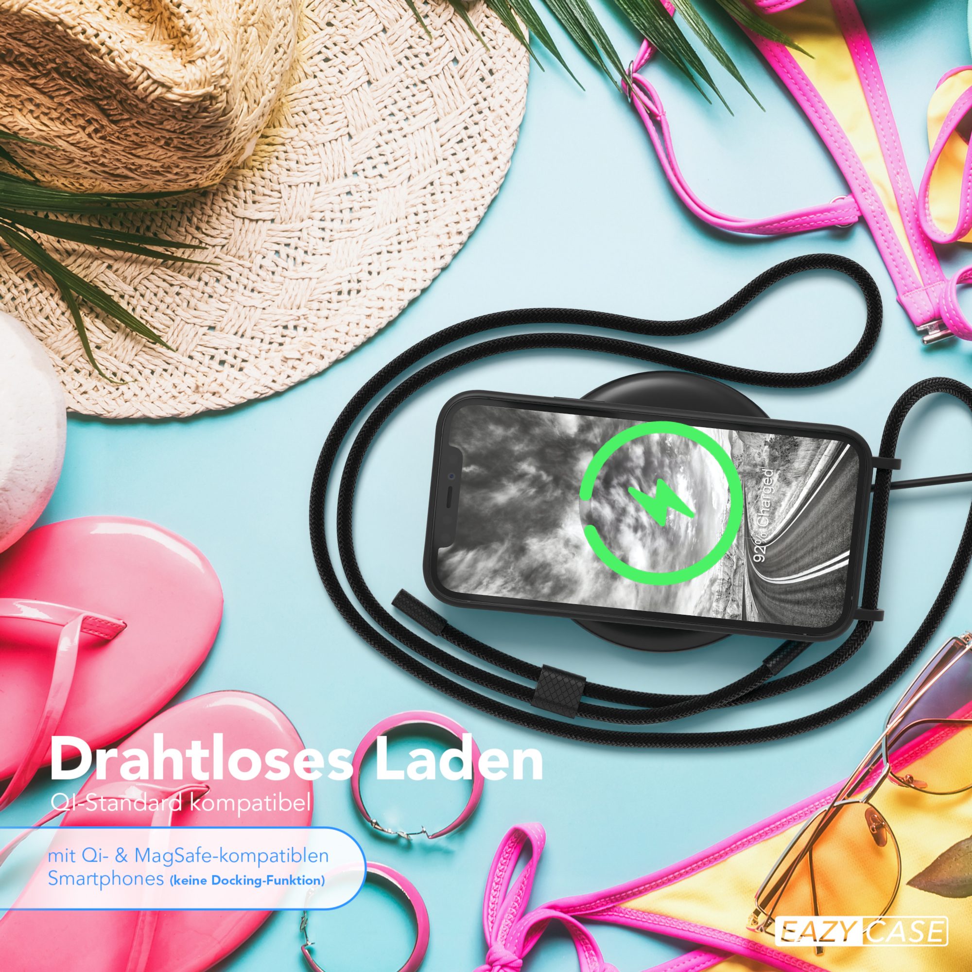 Ein Telefon wird auf einem kabellosen Ladegerät aufgeladen, mit Hut, Sonnenbrille und Flip-Flops drumherum.