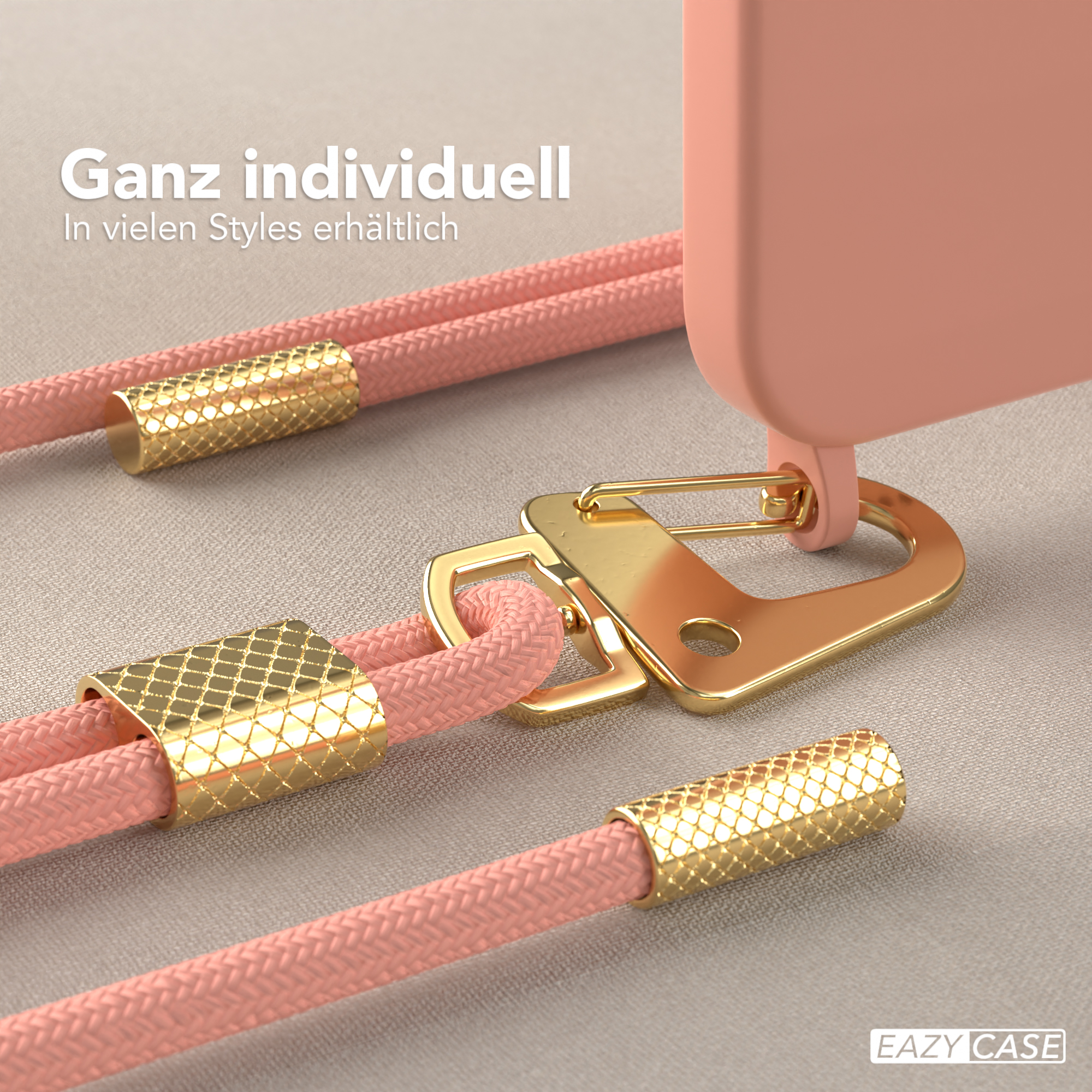 Eine rosa Handyhülle mit rosa Seil und goldener Hardware, einschließlich Haken und dekorativen Endkappen.