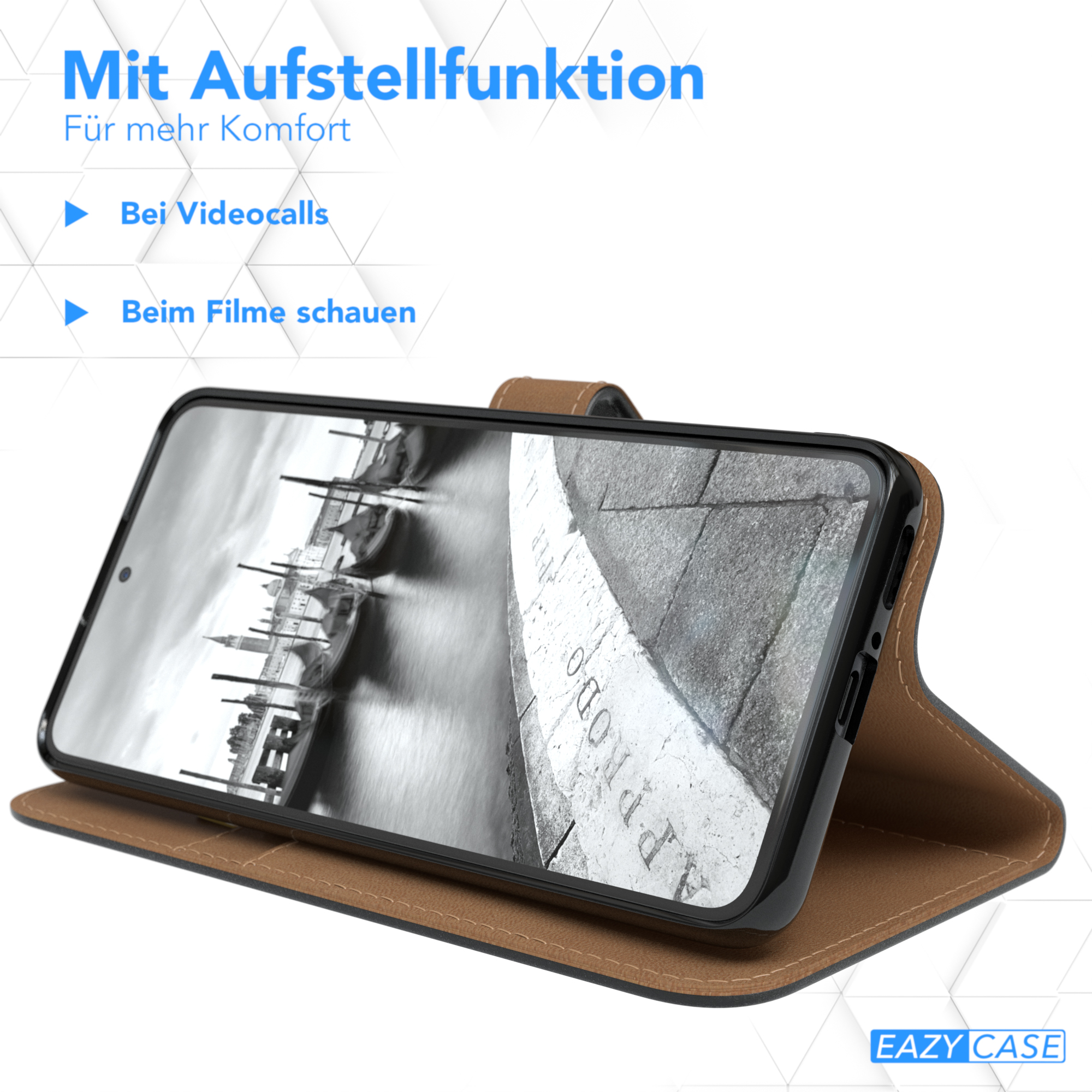 Telefon in brauner Hülle, geöffnet. Das Telefon liegt auf dem Tisch, mit Blick auf den Bildschirm. Text: Aufstellfunktion.