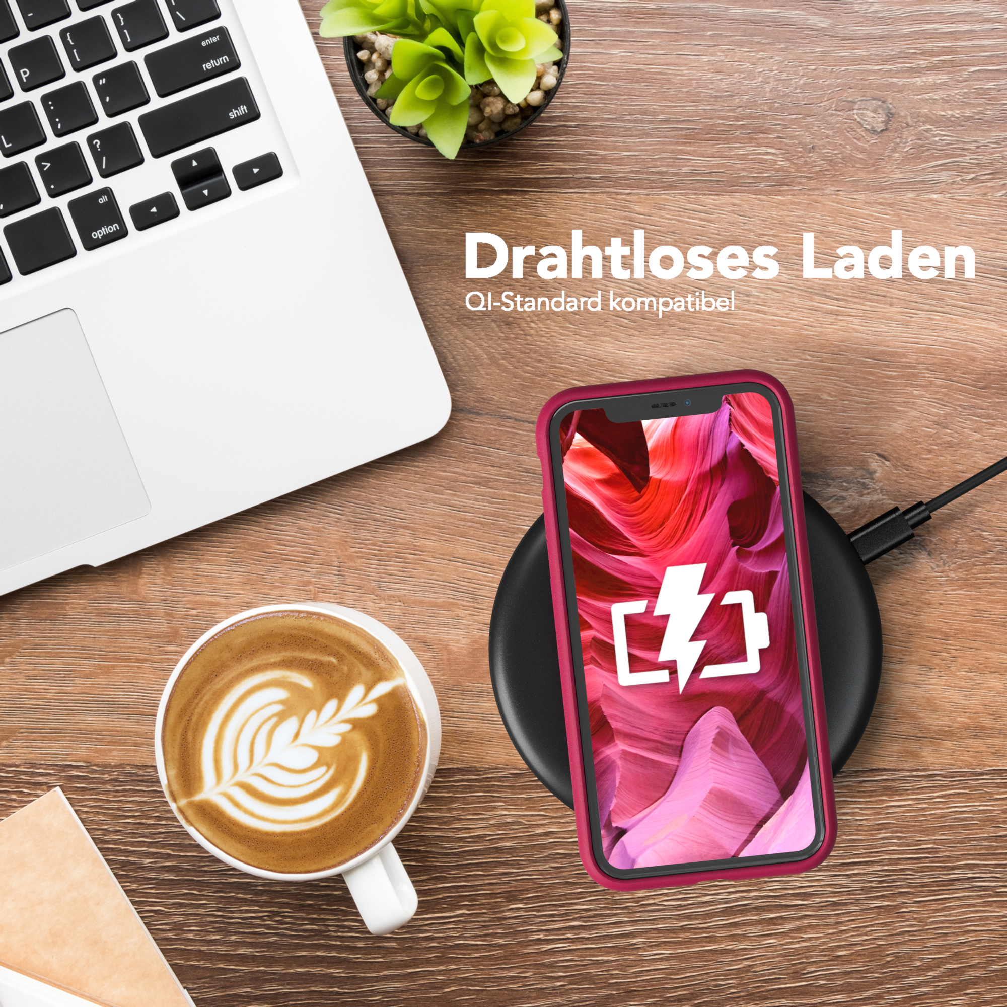 Telefon in roter Hülle auf kabellosem Ladegerät. Kaffee und Laptop im Hintergrund. Text: Kabelloses Laden.