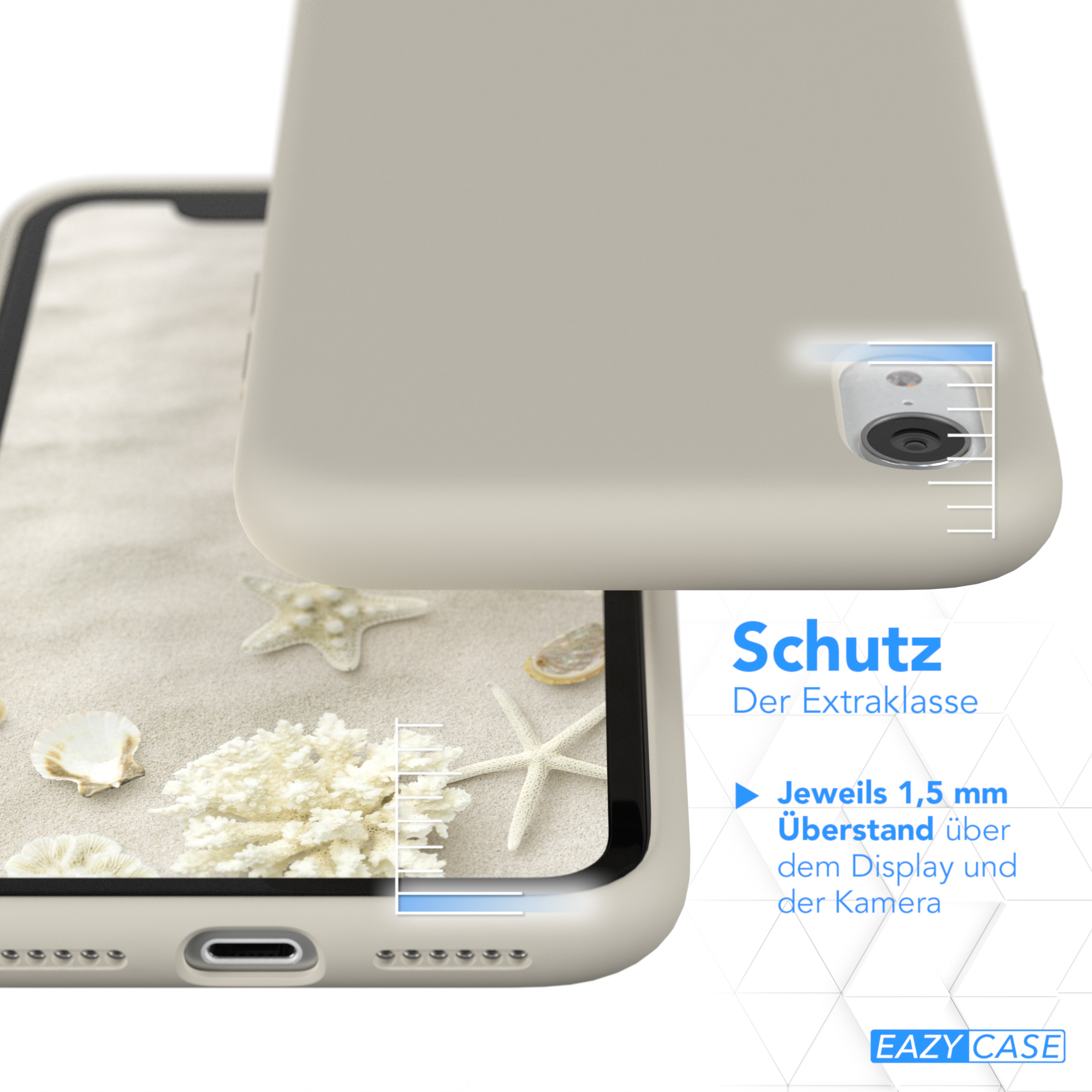 Ein Telefon in einer weißen Hülle auf sandigem Untergrund mit Muscheln und Seesternen, wobei der Bildschirm- und Kameraschutz hervorgehoben wird.