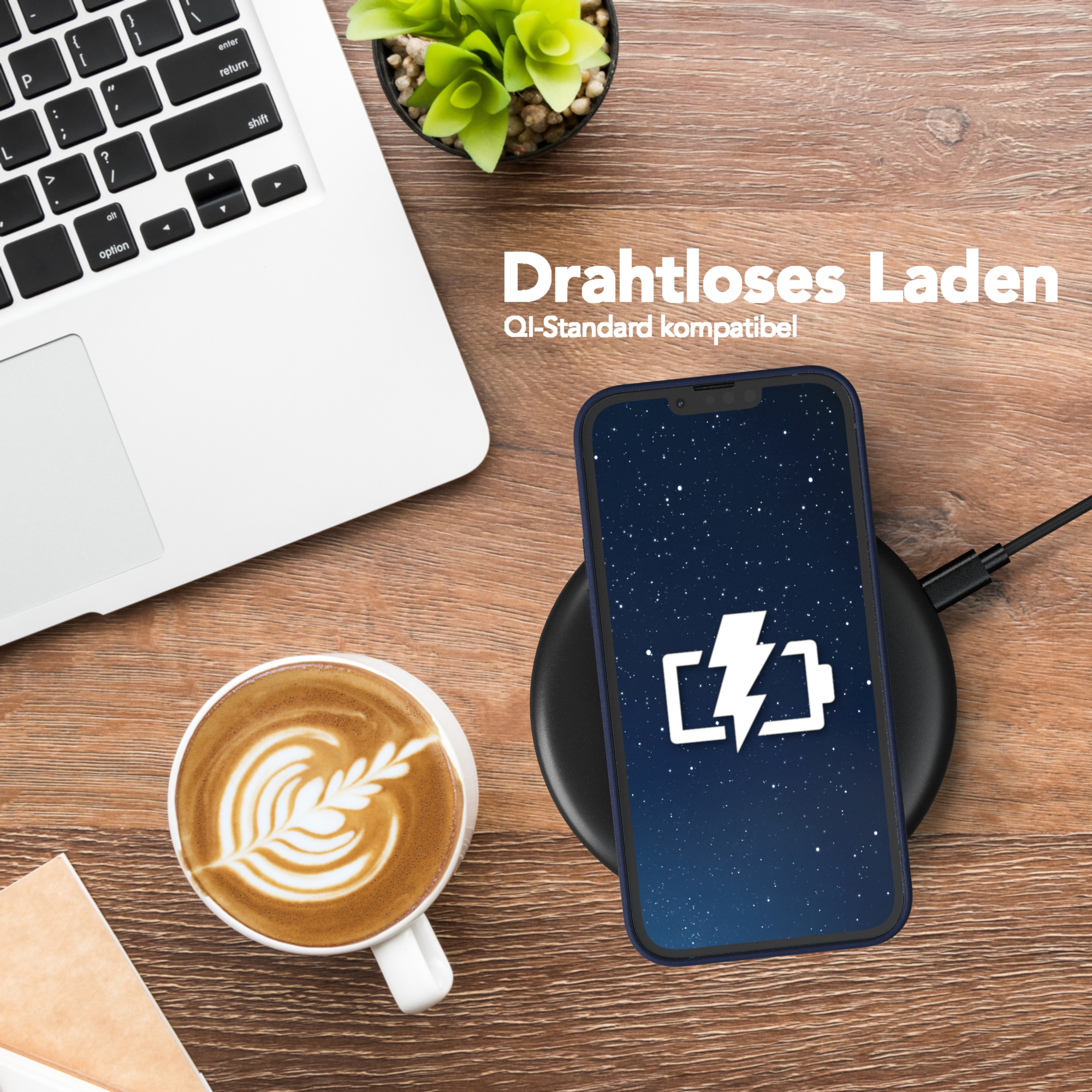 Ein Telefon wird mit einem kabellosen Ladegerät geladen, daneben eine Tasse Kaffee und ein Laptop.