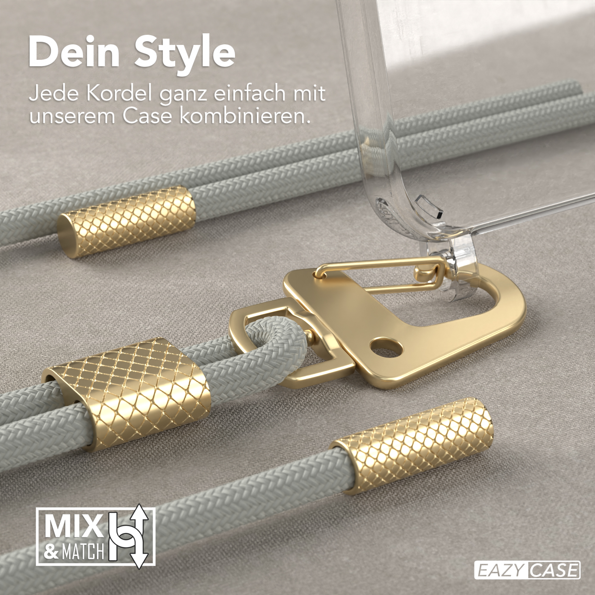 Nahaufnahme einer goldenen Telefonschnur, einer Handyhülle und einem goldenen Verschluss auf grauem Untergrund.