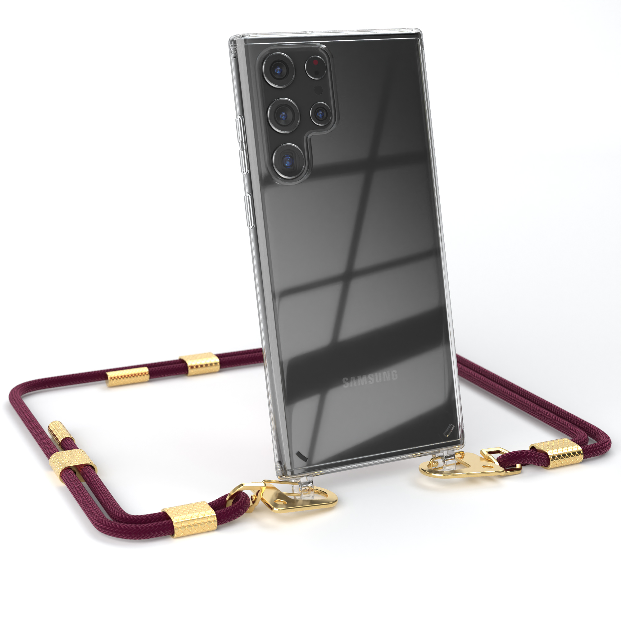 Eine transparente Handyhülle mit weinrotem Band und goldenen Akzenten, ein Samsung Telefon.