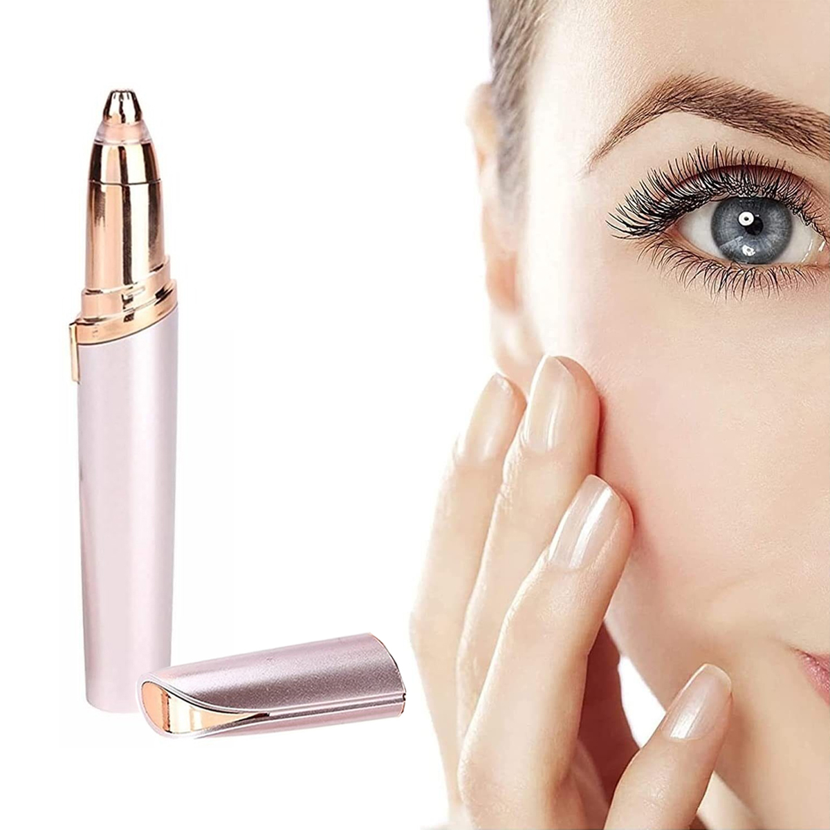 Das Gesicht einer Frau mit einem Augenbrauen-Trimmer, rosa und gold, neben ihrem Auge.