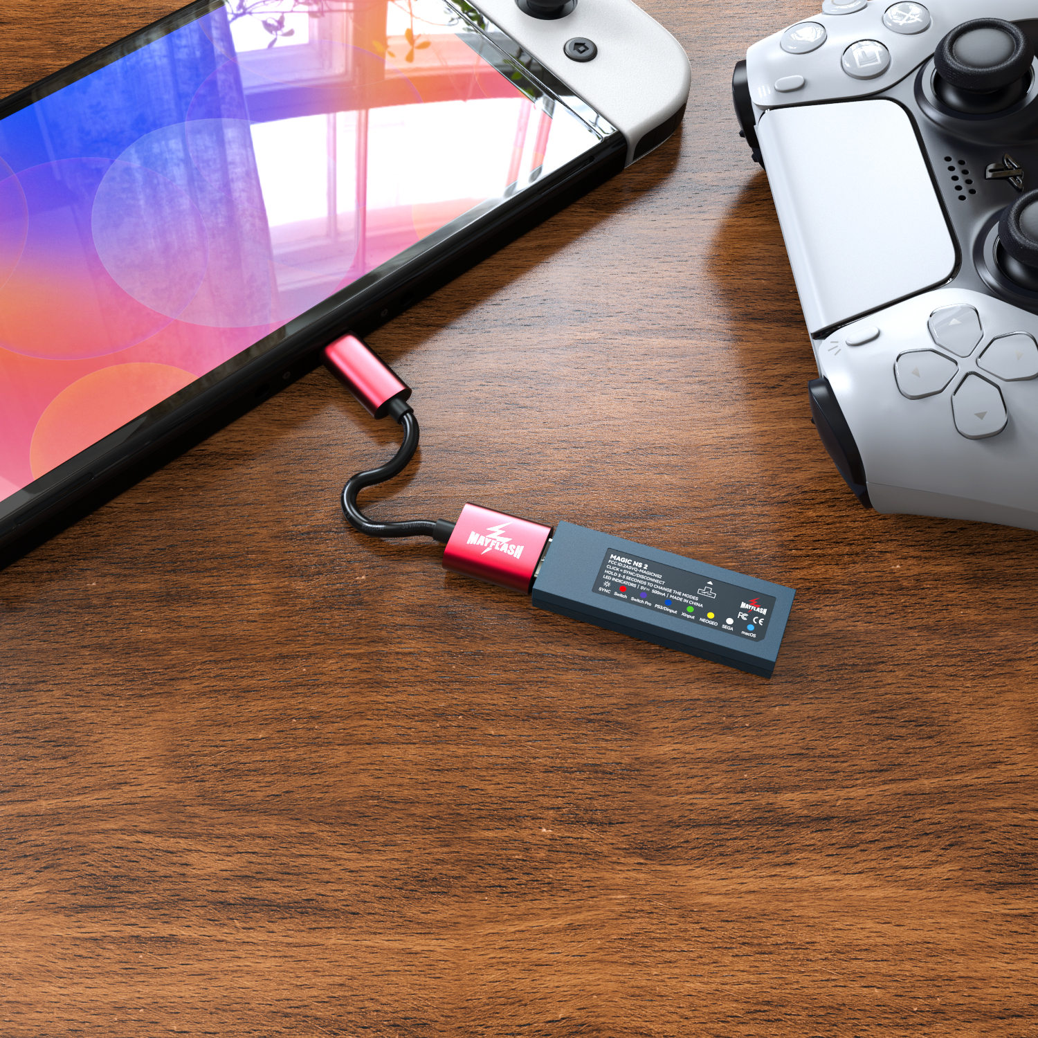 Una consola de juegos y un teléfono con un cable de carga conectado. El cable está conectado a un dispositivo.