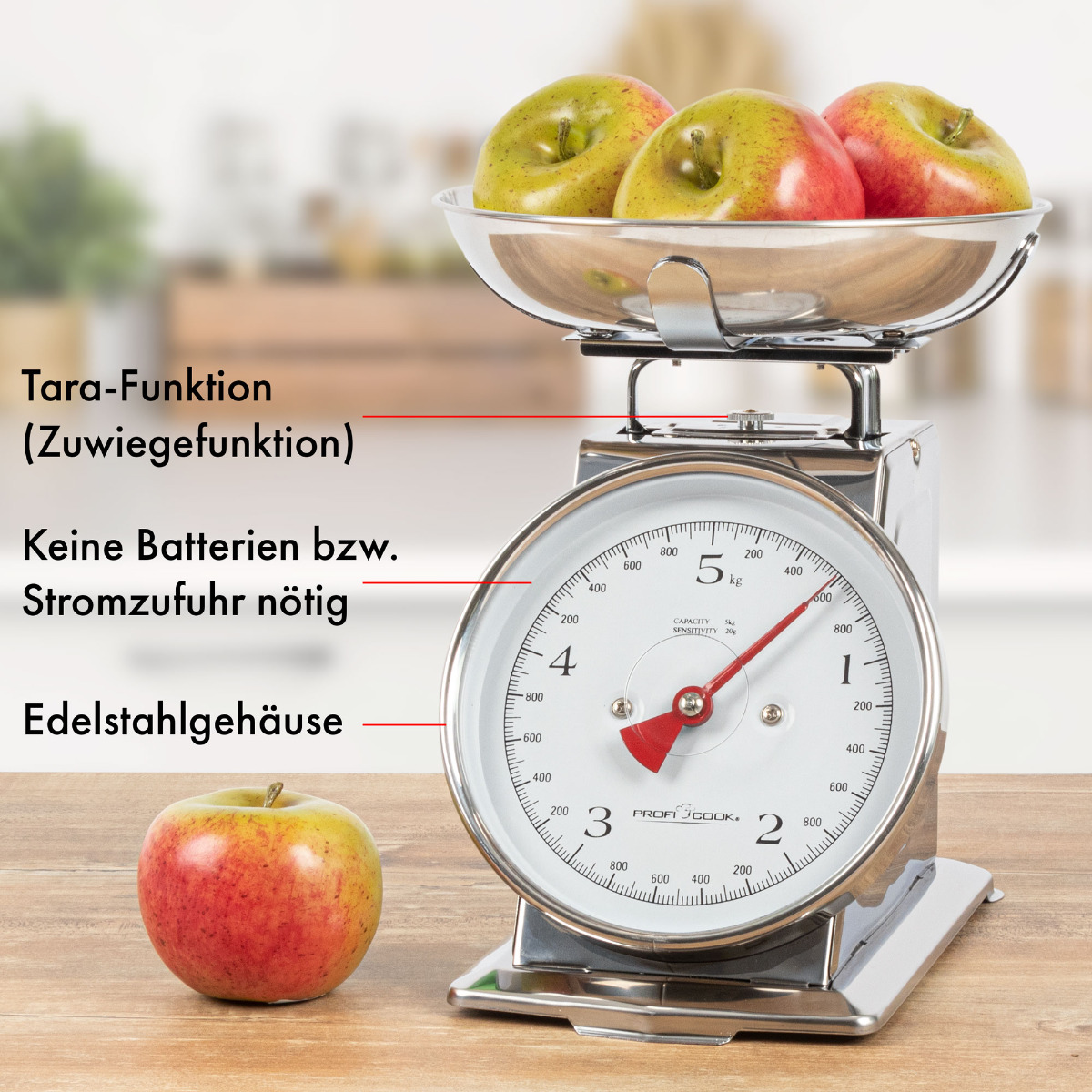 Waga z jabłkami na górze i jabłkiem z przodu. Tekst wskazuje funkcje i materiały.