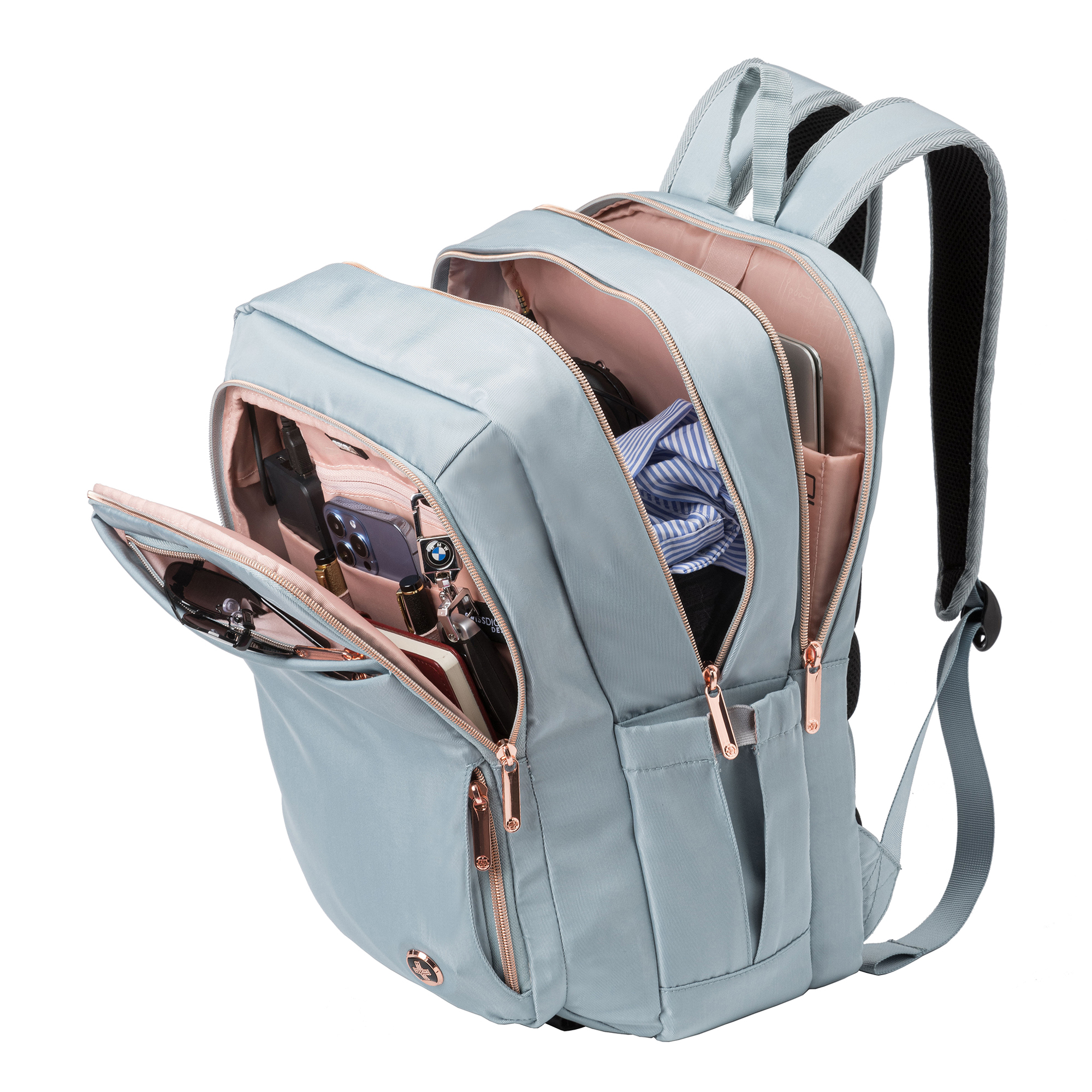 Hellblauer Rucksack mit mehreren offenen Fächern, die den Inhalt, einschließlich Schlüssel und Telefon, zeigen.