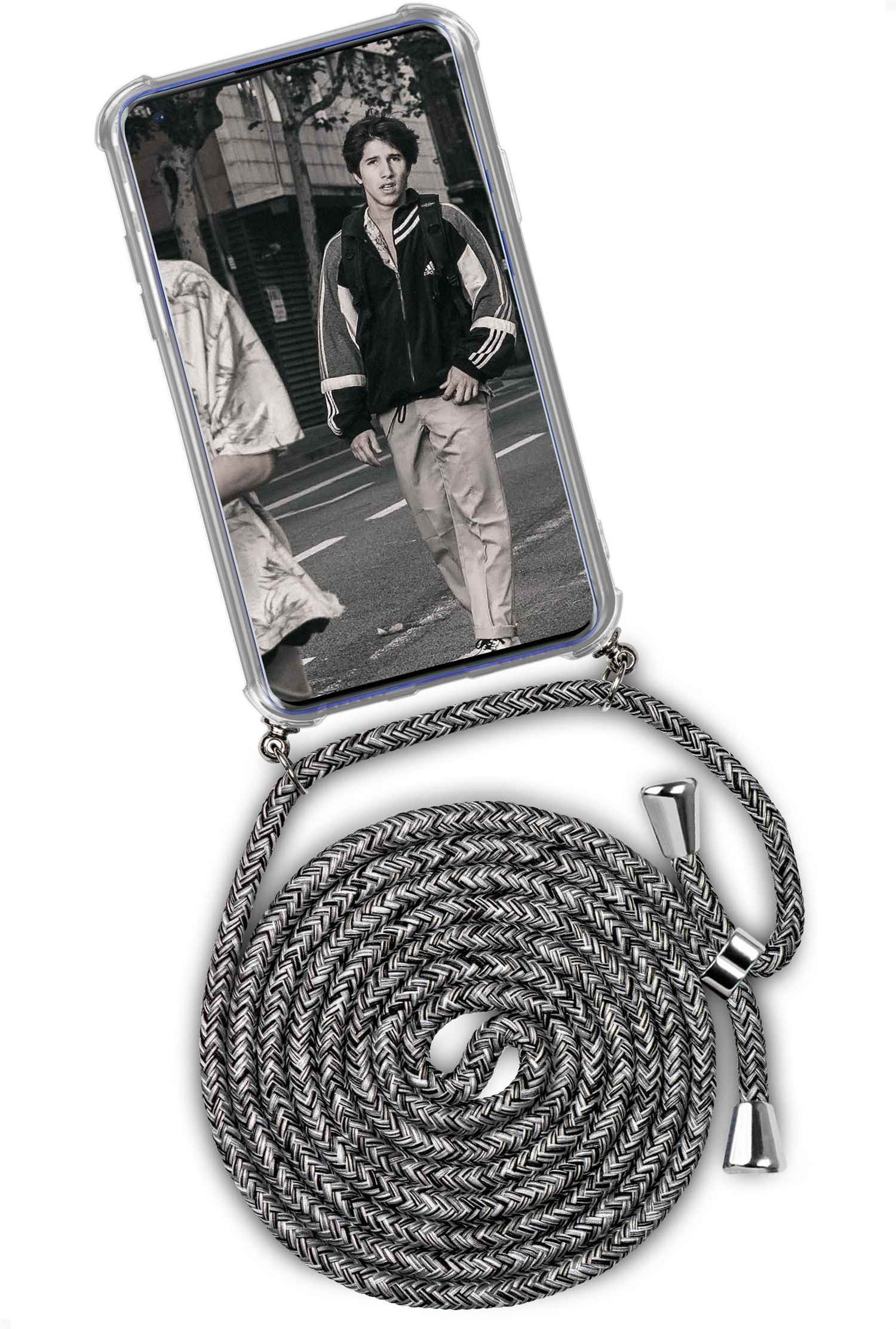 Telefon mit Straßenszenenfoto, grau-schwarzes Kabel. Ein Mann in Jacke und Hose geht entlang.