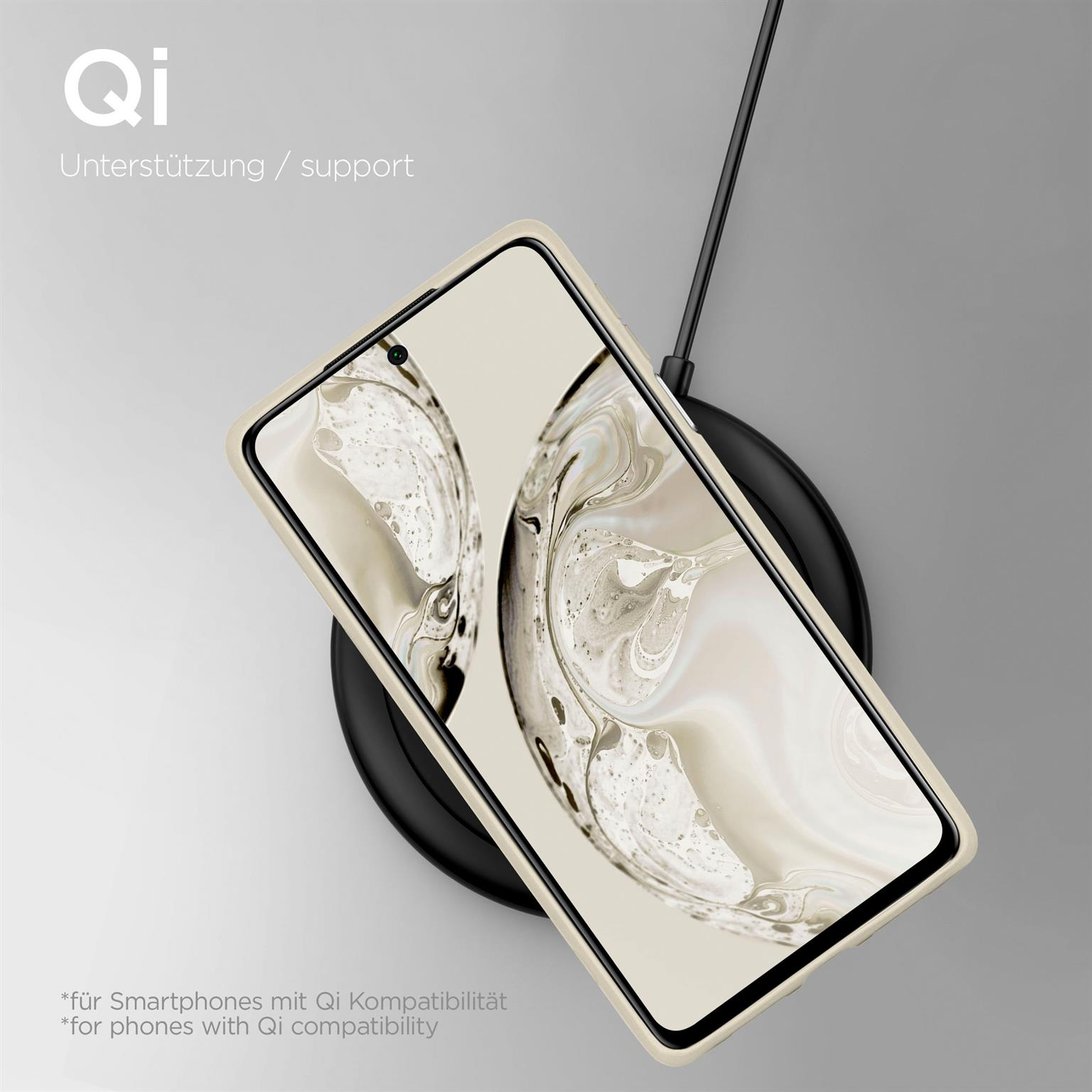 Telefon auf einem kabellosen Ladegerät. Text: 'Qi' und 'Qi-Kompatibilität' mit schwarzem Kabel.