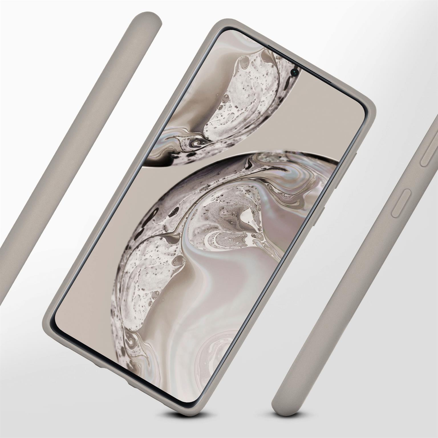 Ein Telefon in einem grauen Gehäuse, abgewinkelt. Graue Balken sind im Hintergrund.