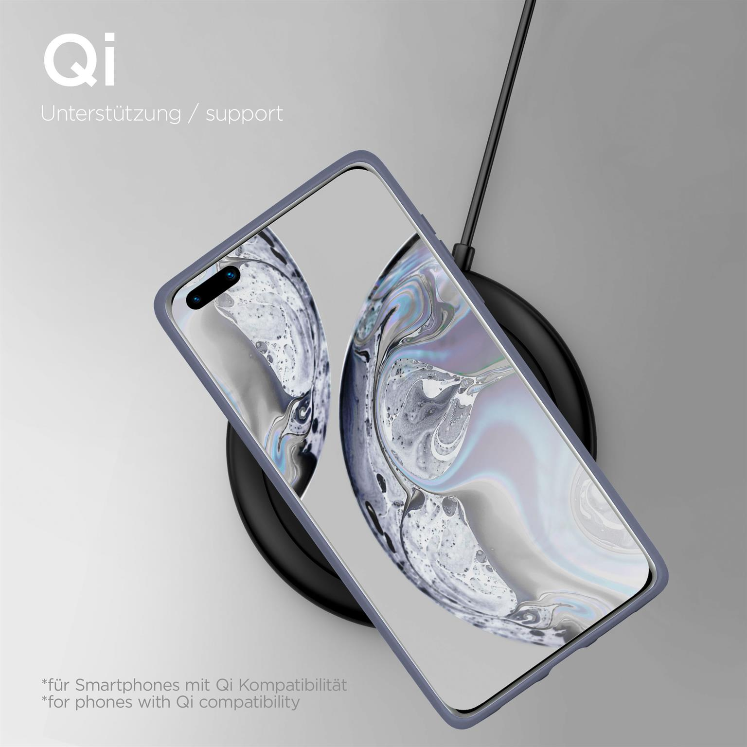 Ein Smartphone lädt auf einer Qi-Ladestation mit blauem Rand.