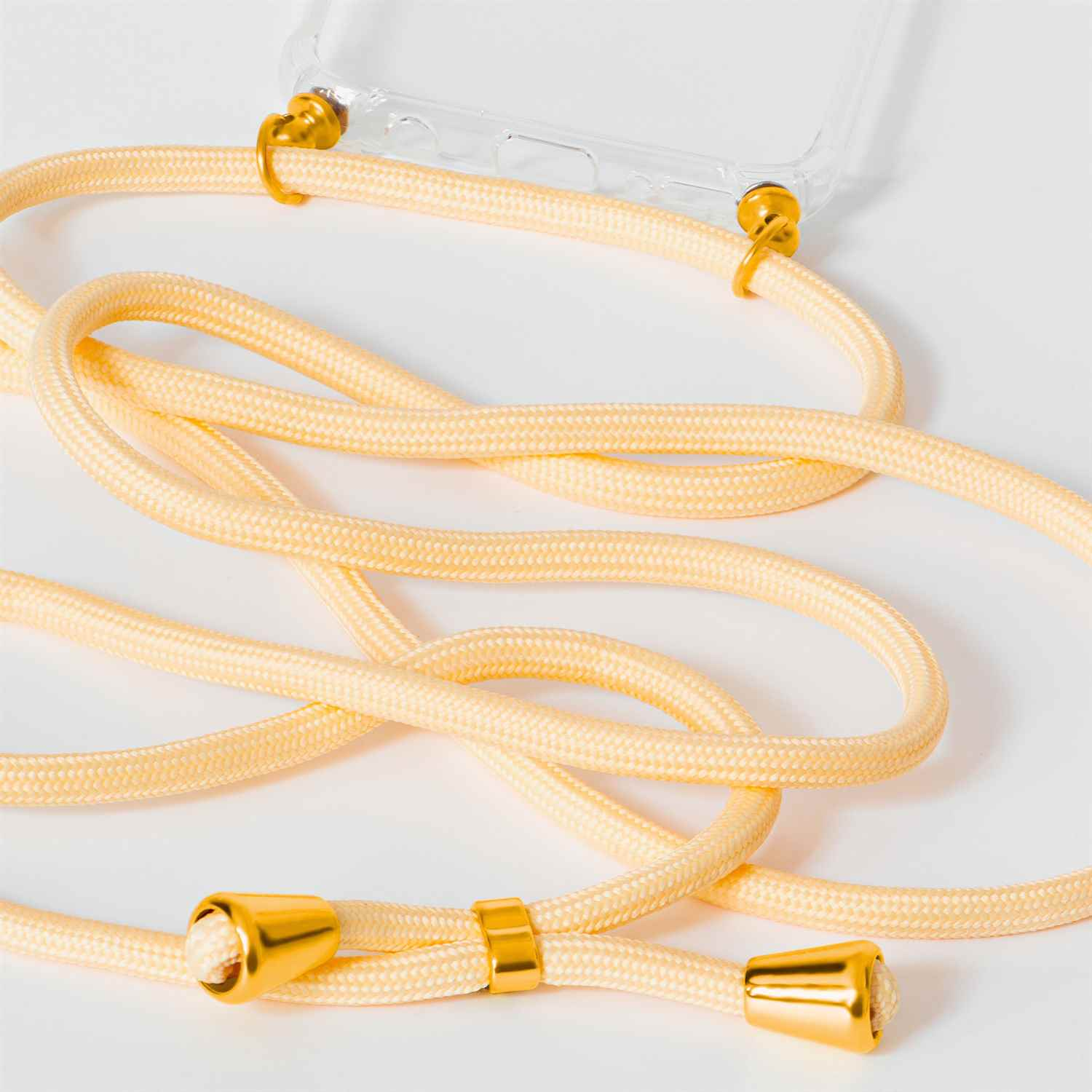 Nahaufnahme eines Handyhüllen-Lanyards. Das Kabel ist hellgelb mit goldenen Akzenten.