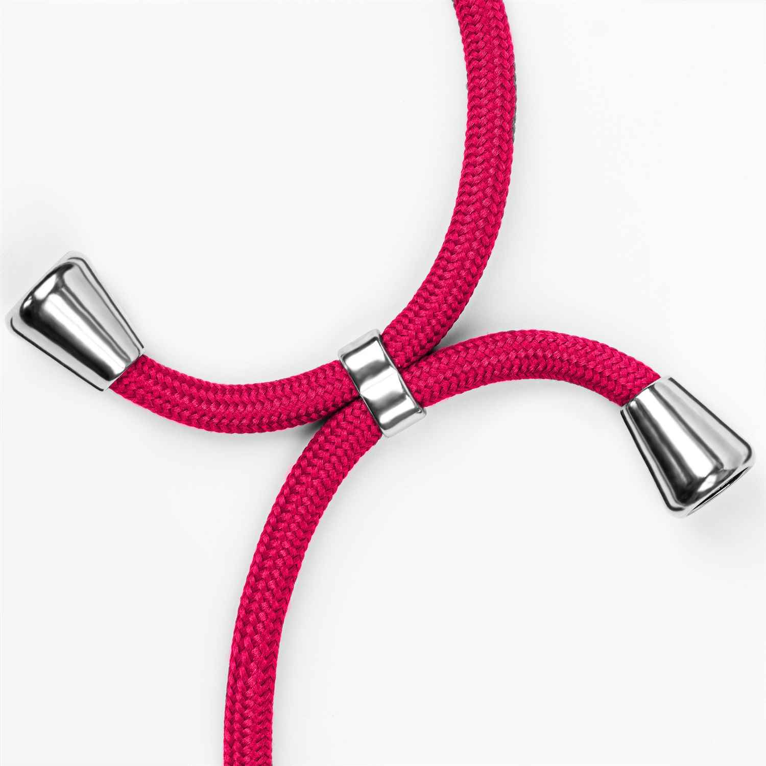 Pinkfarbenes Telefonkabel mit silbernen Spitzen und Ring auf weißem Hintergrund.