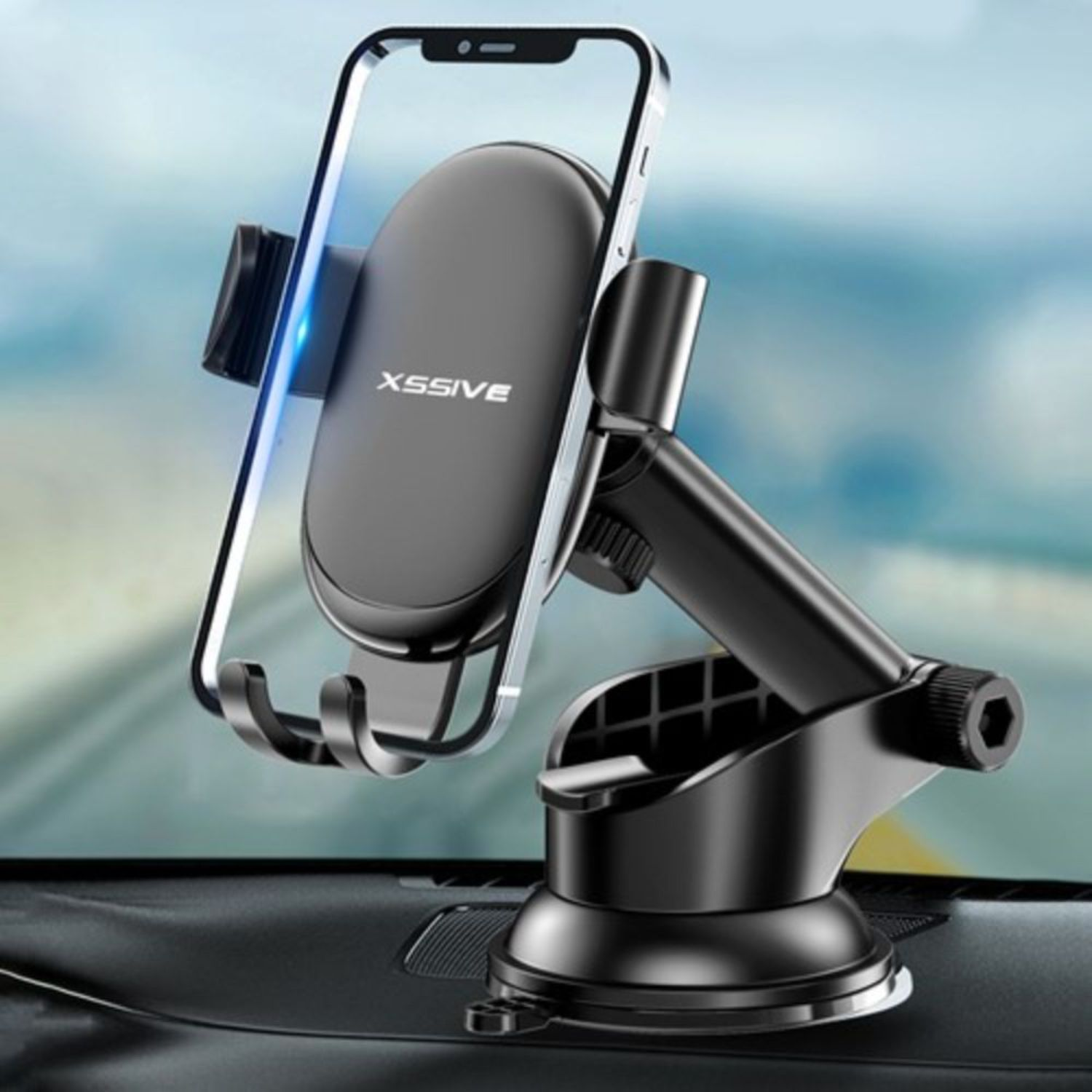 Schwarze Autotelefonhalterung auf dem Armaturenbrett eines Autos. Ein Telefon ist darin befestigt.