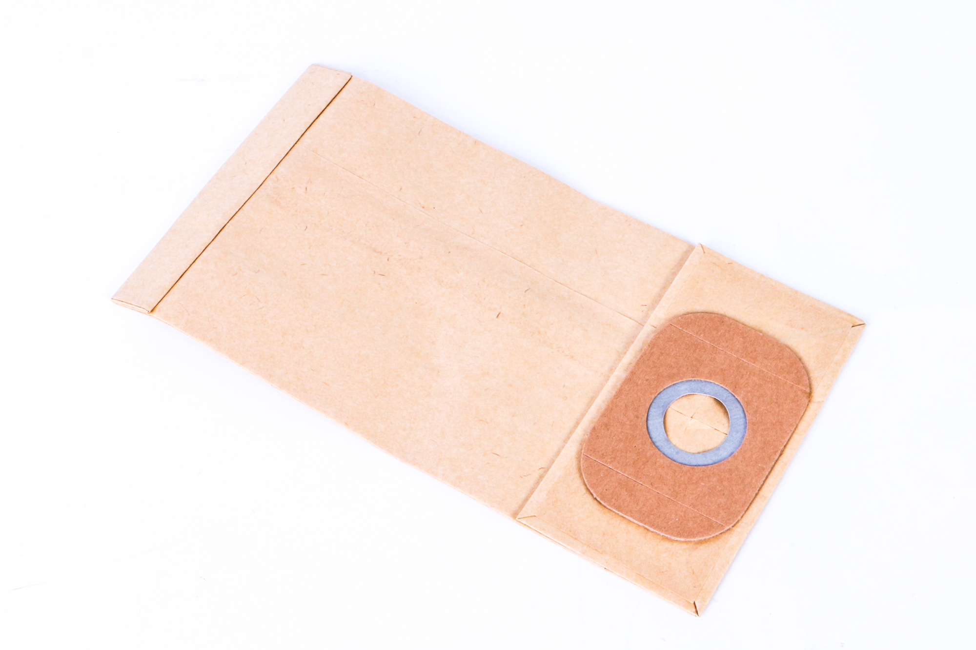 Ein brauner Papierstaubsaugerbeutel mit einer kreisförmigen Öffnung.