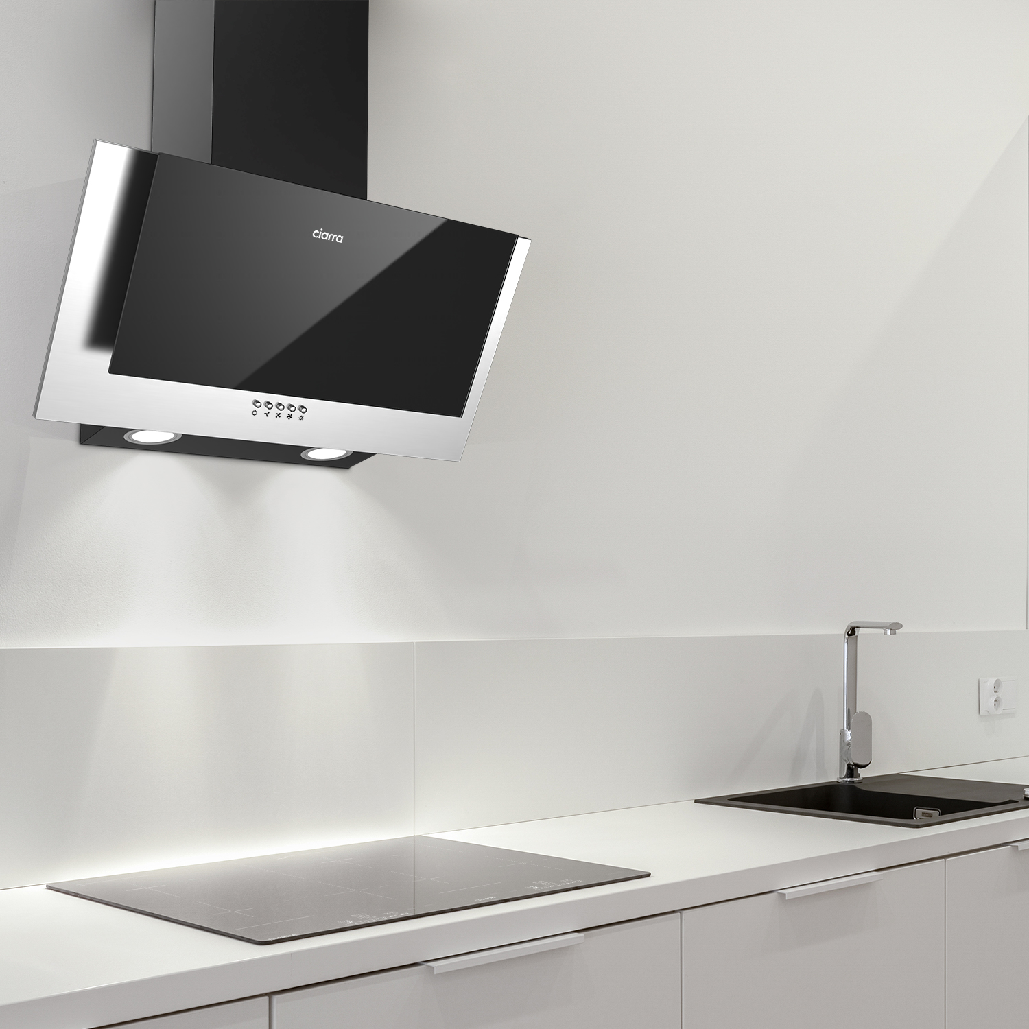 Een moderne keuken met een zwarte afzuigkap, een zwarte kookplaat en witte kasten.