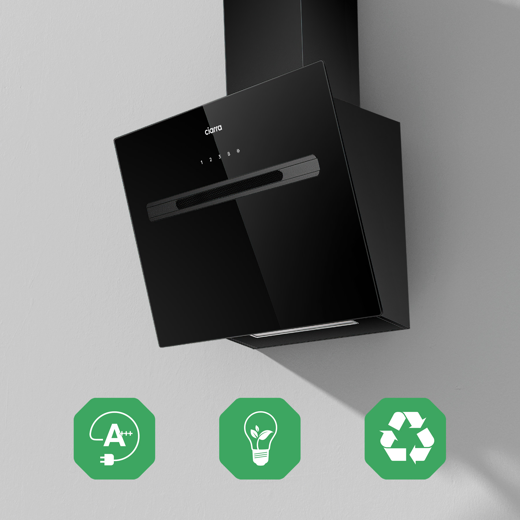 Eine schwarze Dunstabzugshaube mit Bedienfeld. Drei grüne Symbole darunter, die Energieeffizienz anzeigen.