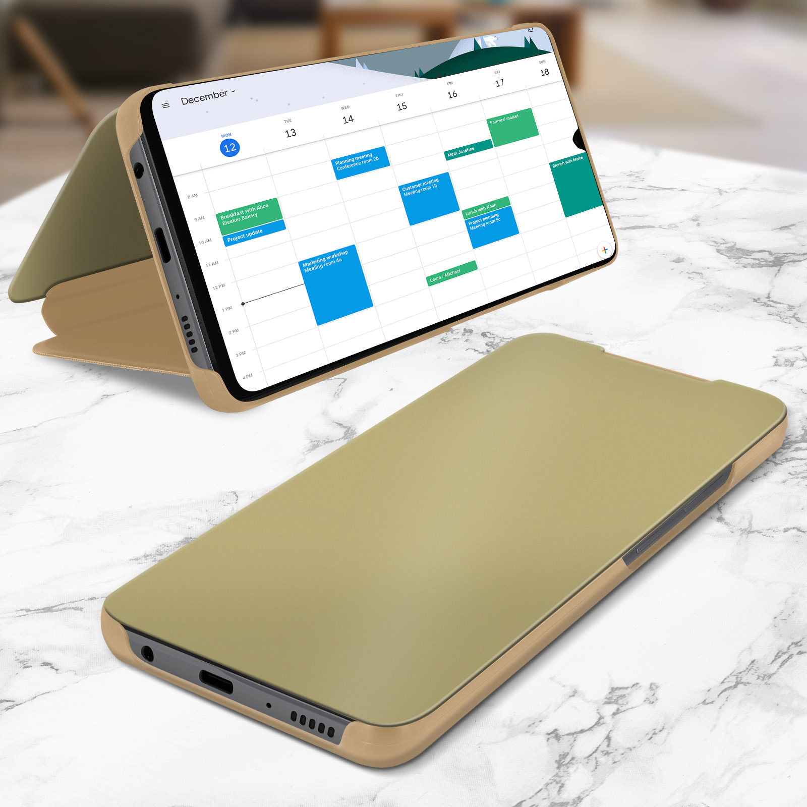 Telefono in una custodia con calendario visualizzato. La custodia è aperta su una superficie di marmo.