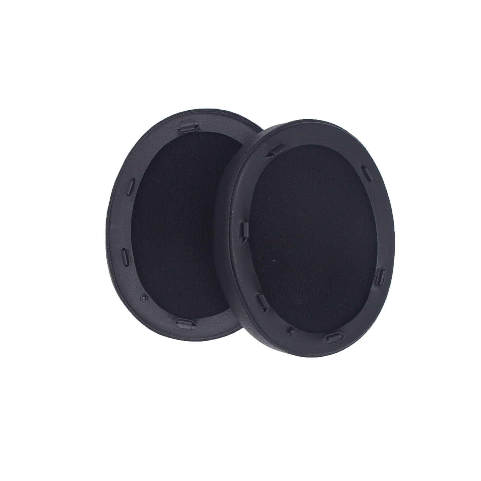 Dwie czarne nausznice. Białe tło.