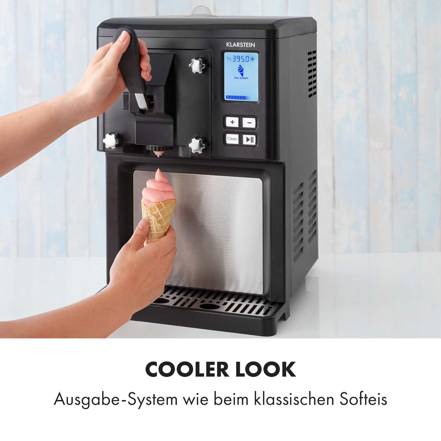 Schwarze Eismaschine, die rosa Eiscreme in einen Kegel ausgibt.