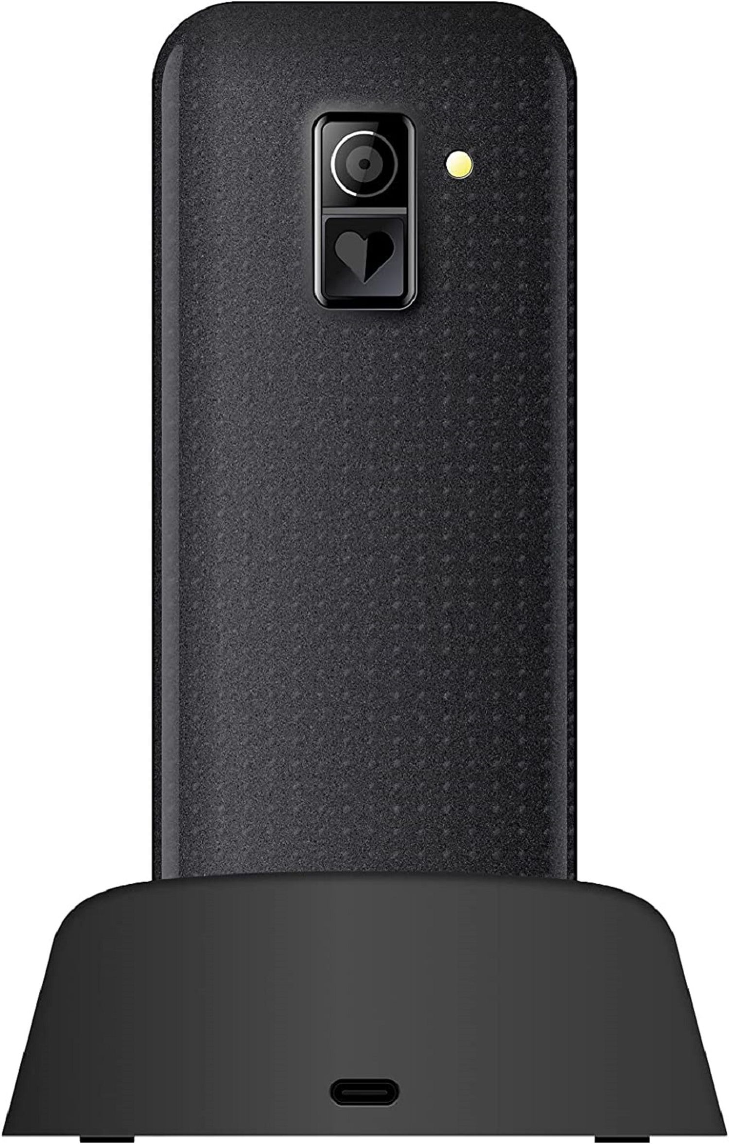 Czarny telefon stojący na czarnej podstawie. Z tyłu ma aparat.