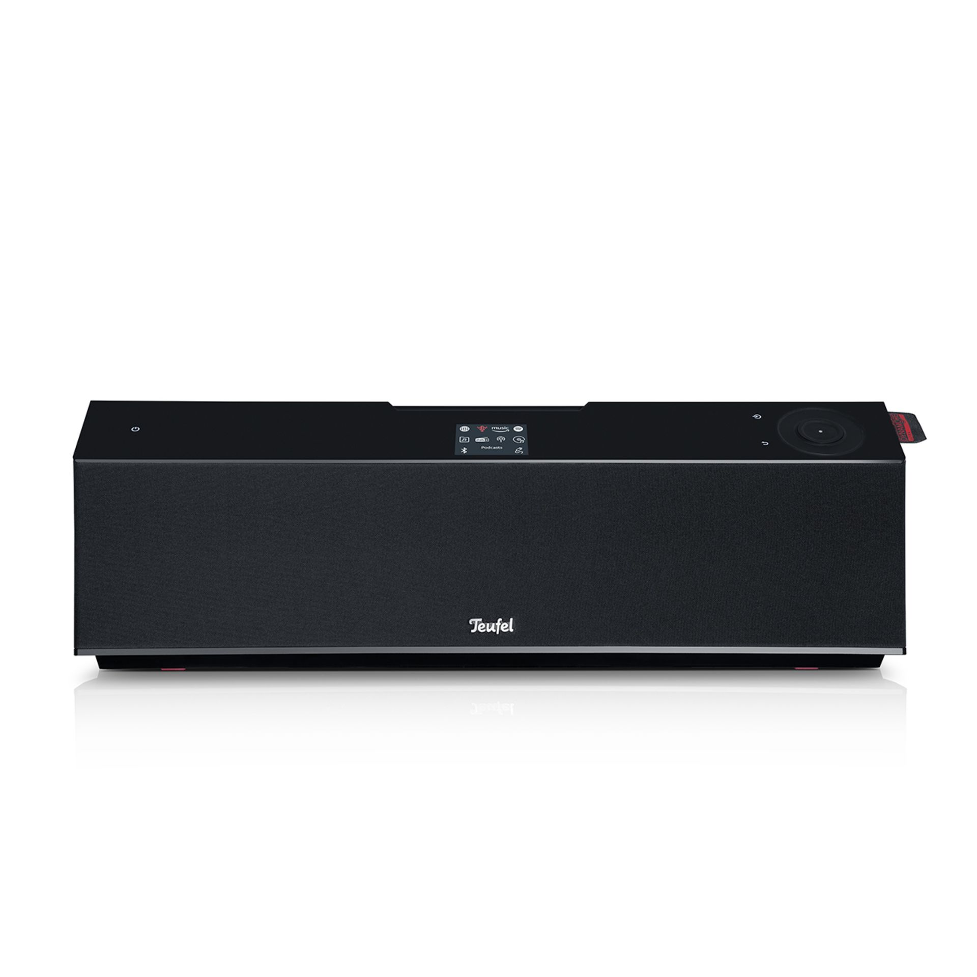 Black Teufel soundbar on a white surface. It has buttons and a display. White background.
