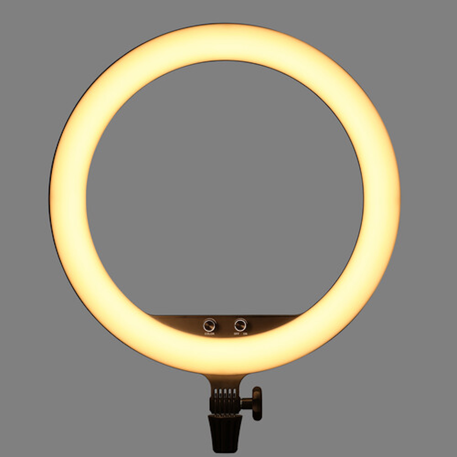 Ein Ringlicht, das warmes Licht aussendet, hat zwei Bedientasten und eine Ständerhalterung.