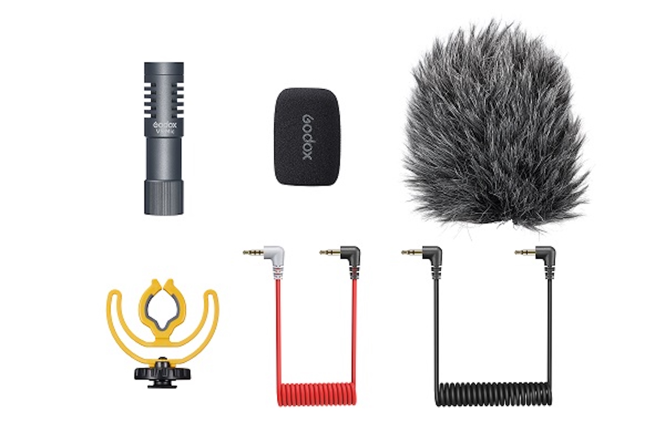 Mikrofon mit Zubehör: Schaumstoffabdeckung, Fell-Windschutz, Stoßdämpfer und Audiokabel. Weißer Hintergrund.