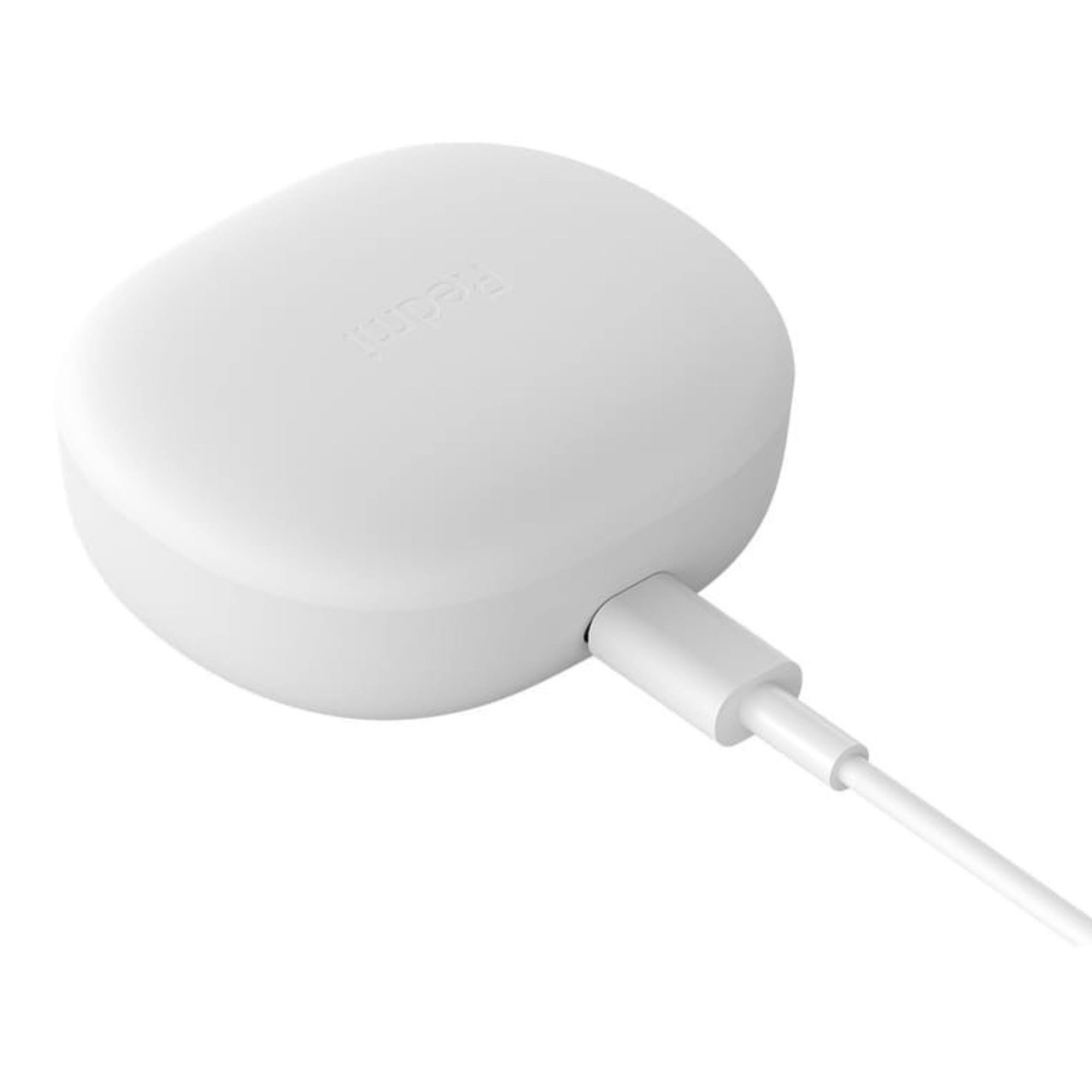 Biała, kwadratowa podkładka ładująca z portem ładowania i kablem. Obecne logo RedMi.