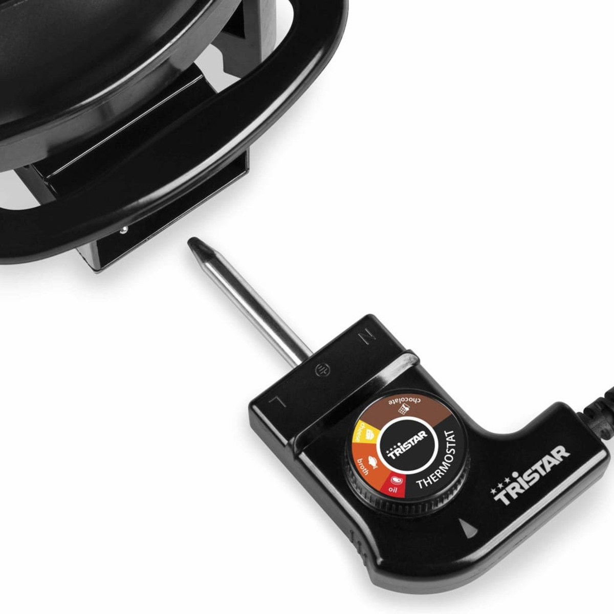 Zbliżenie czarnego panelu sterowania do garnka do fondue z ustawieniami temperatury.