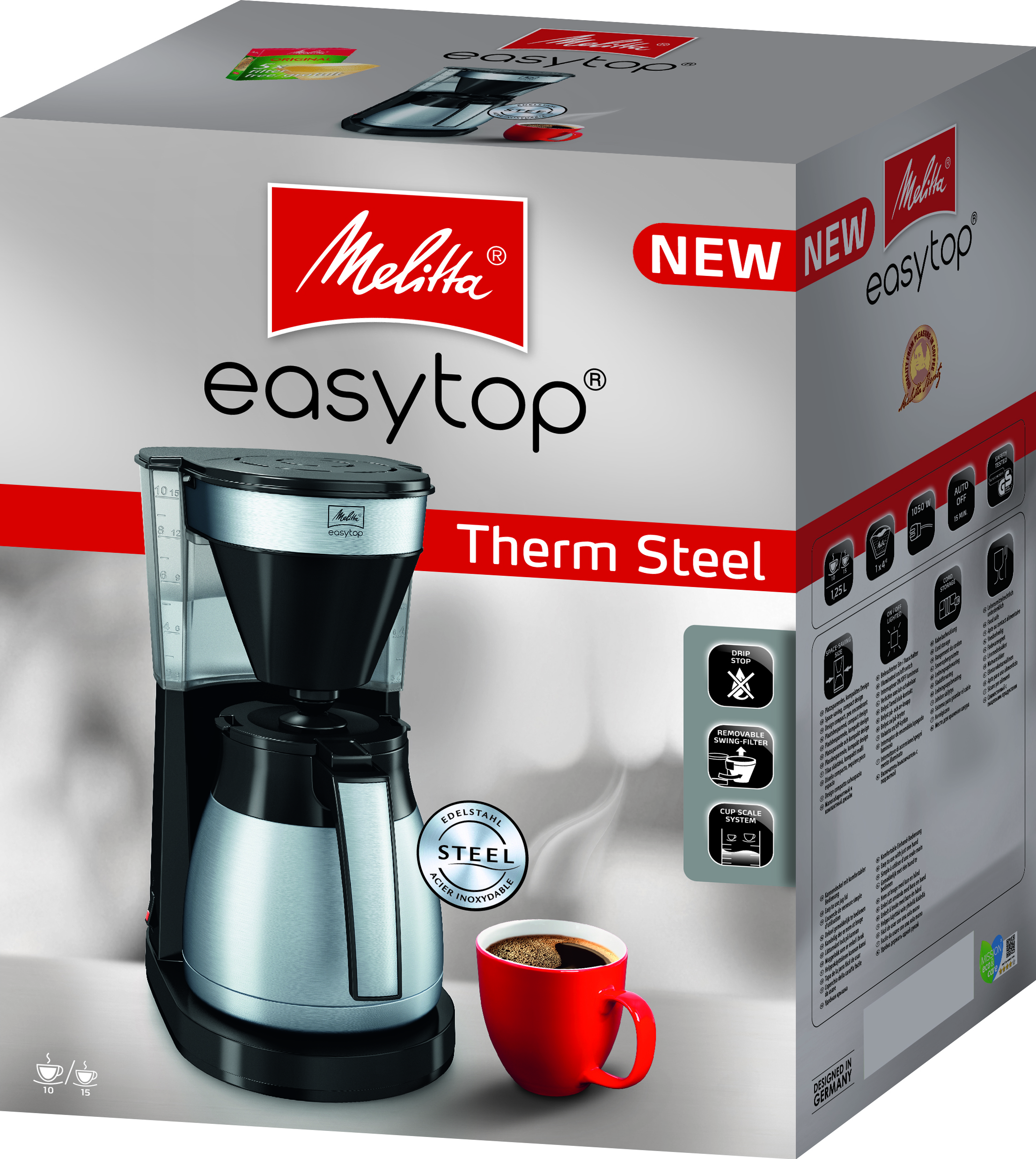 Kaffeemaschine in einer Box mit einer roten Tasse Kaffee. Die Box hat Text darauf.