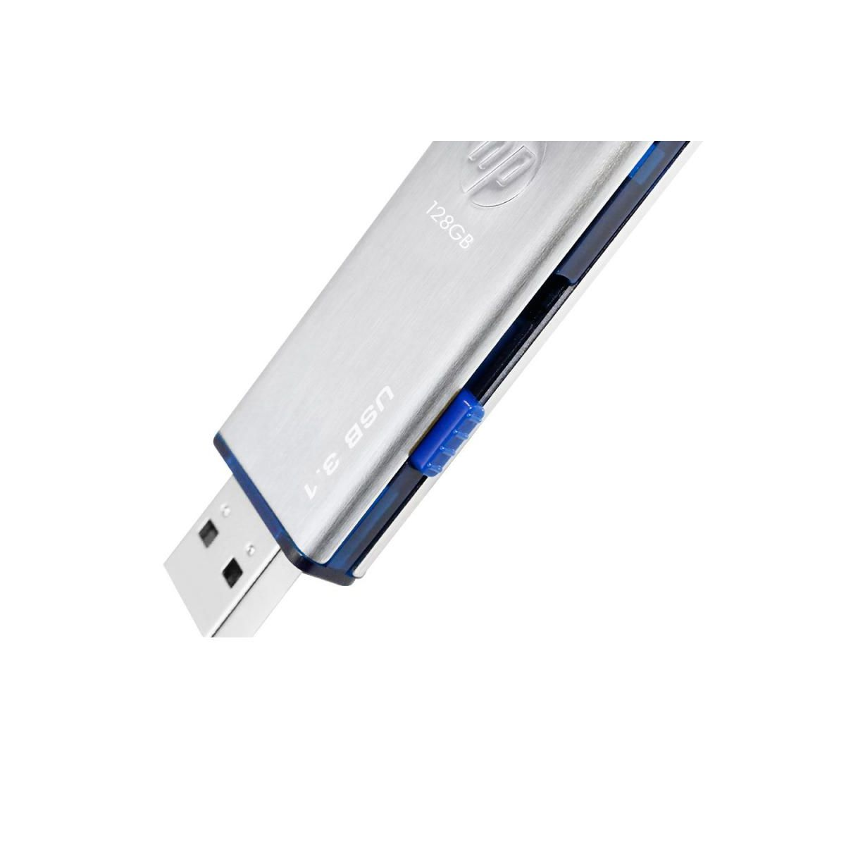 Pen drive USB argentata con dettagli blu. L'unità è collegata a una porta USB.
