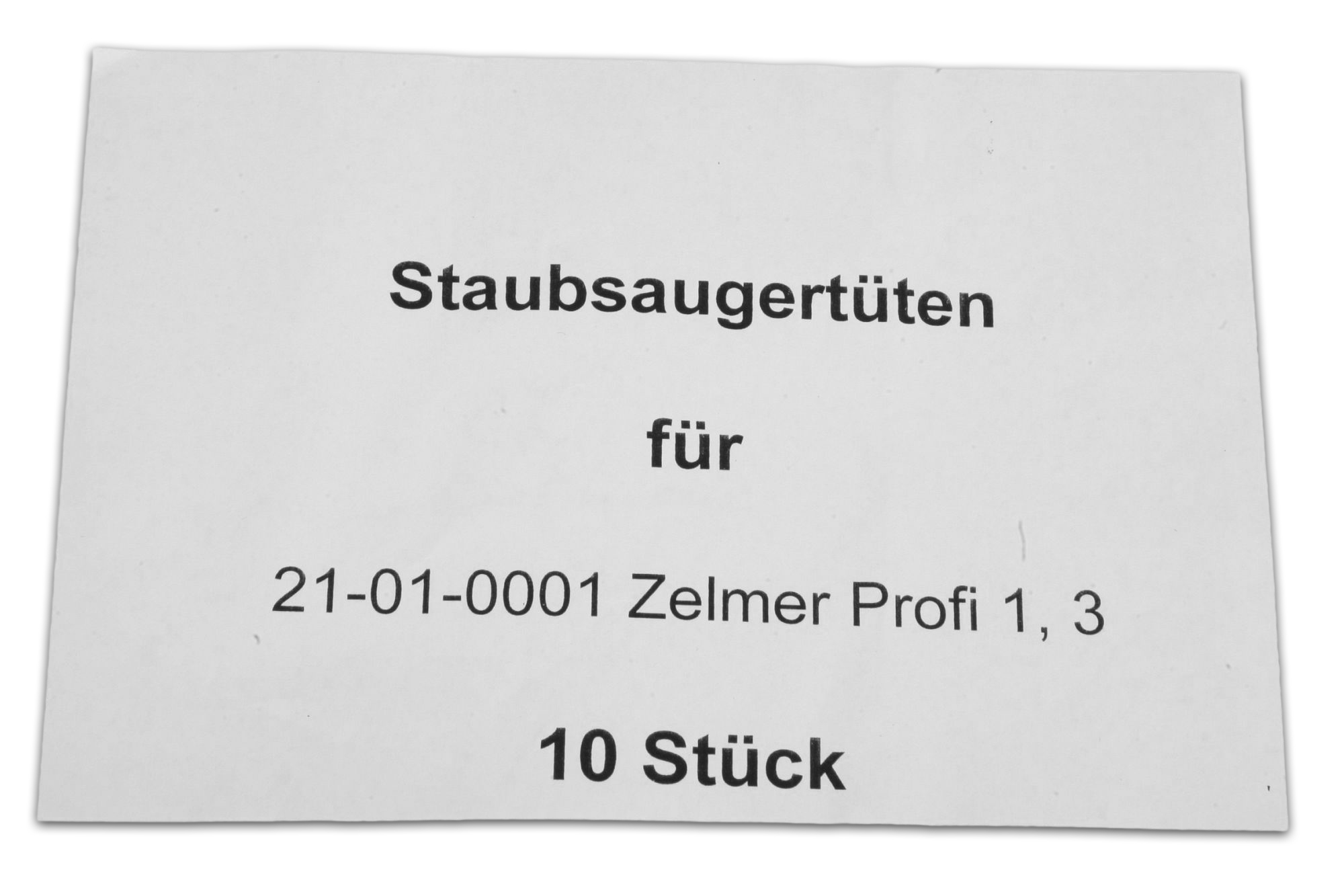 Ein weißes Etikett mit schwarzem Text: 'Staubsaeugertueten fuer...10 Stück'.