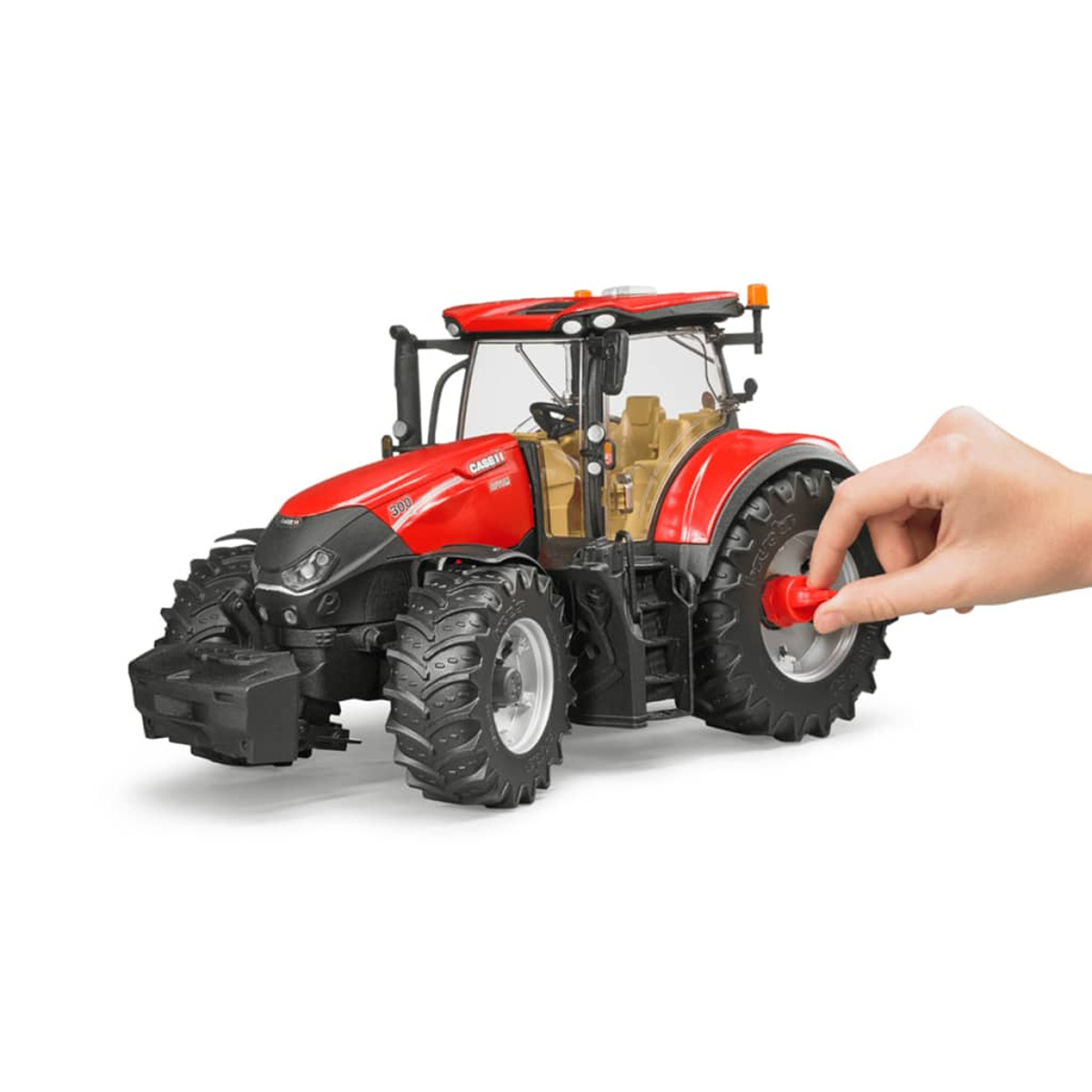 Czerwony traktor z otwartą maską, ręka dotyka opony, białe tło. Case IH 300.