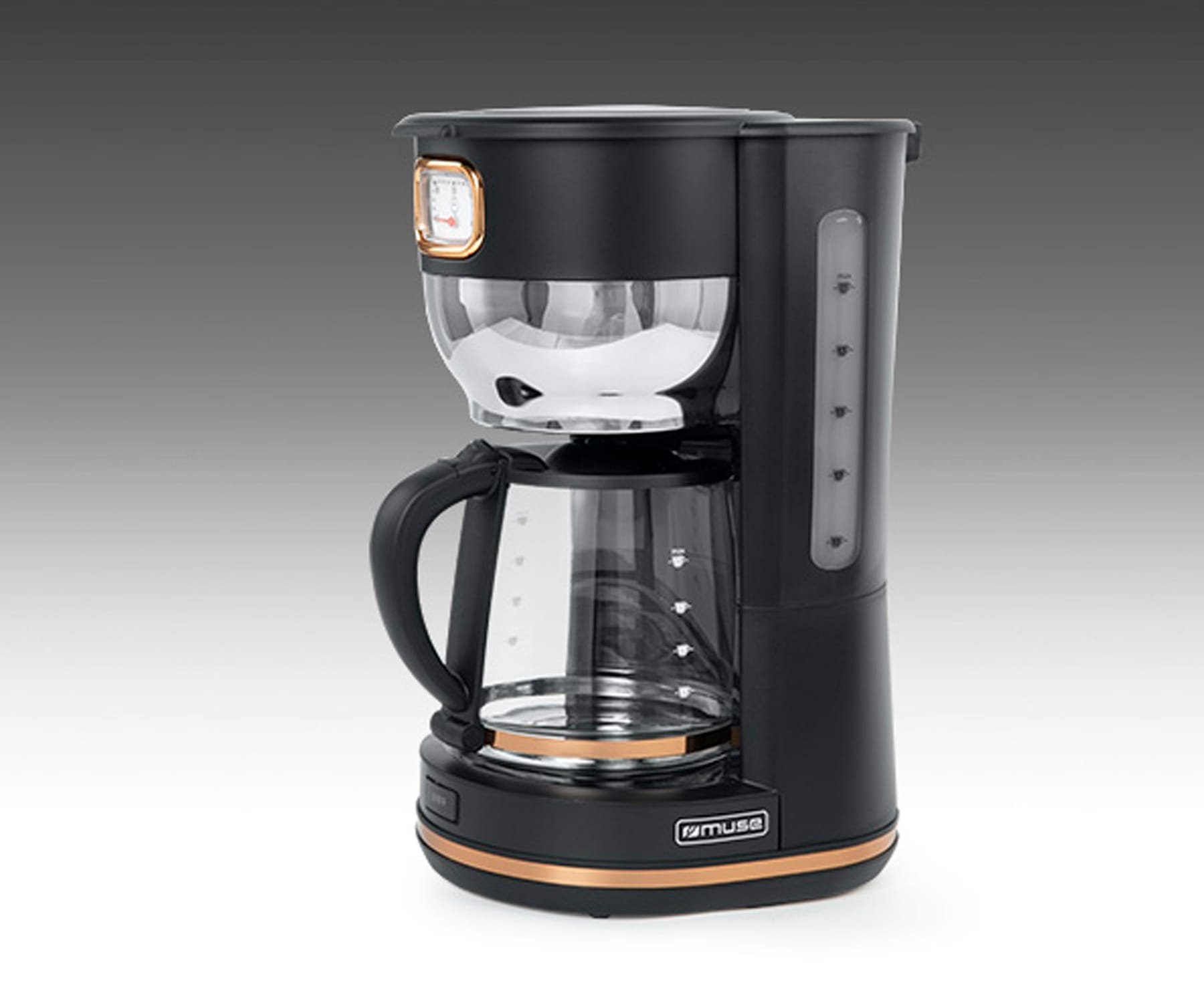 Czarny i miedziany ekspres do kawy. Widoczny szklany dzbanek.