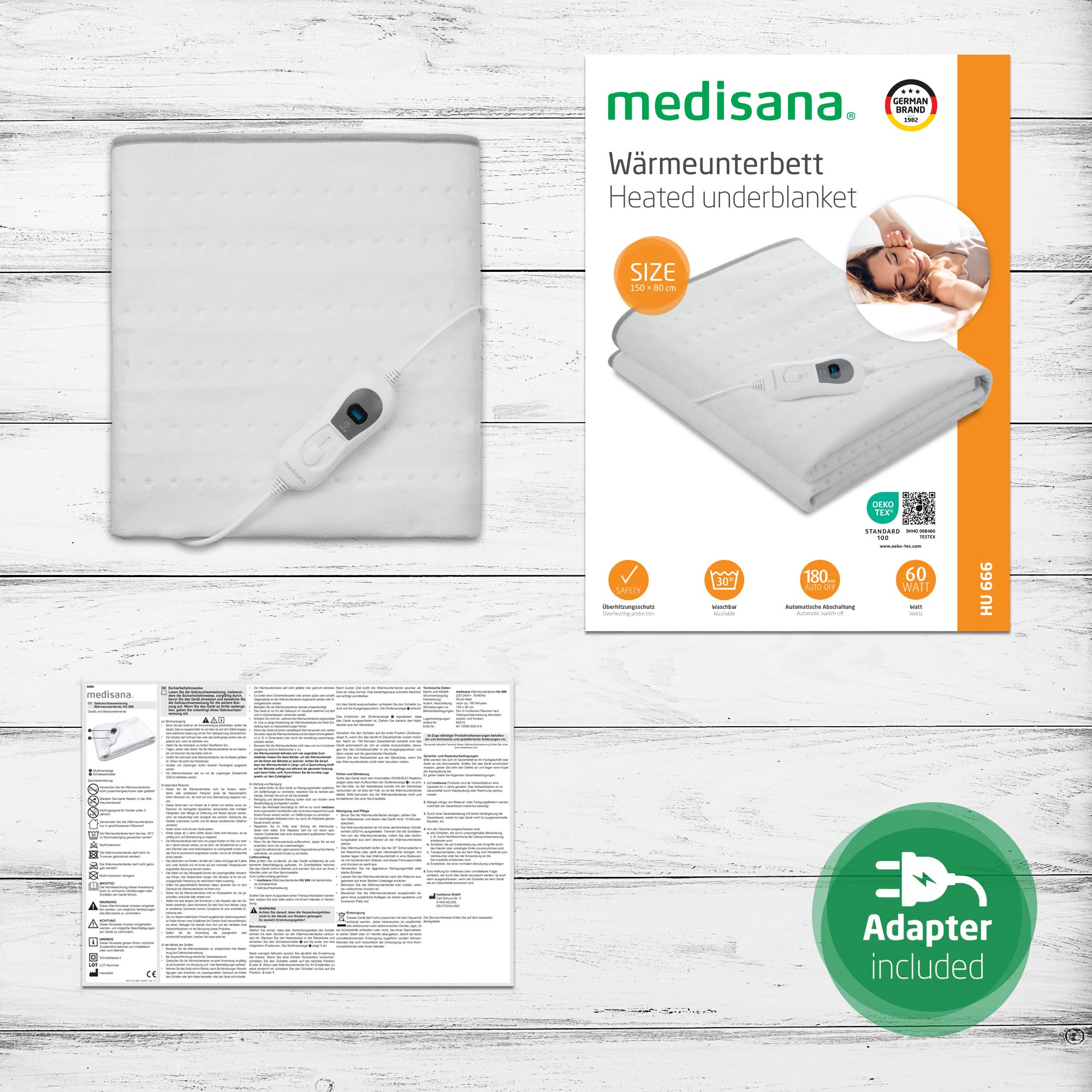Manta eléctrica blanca con control y caja del producto sobre fondo de madera.