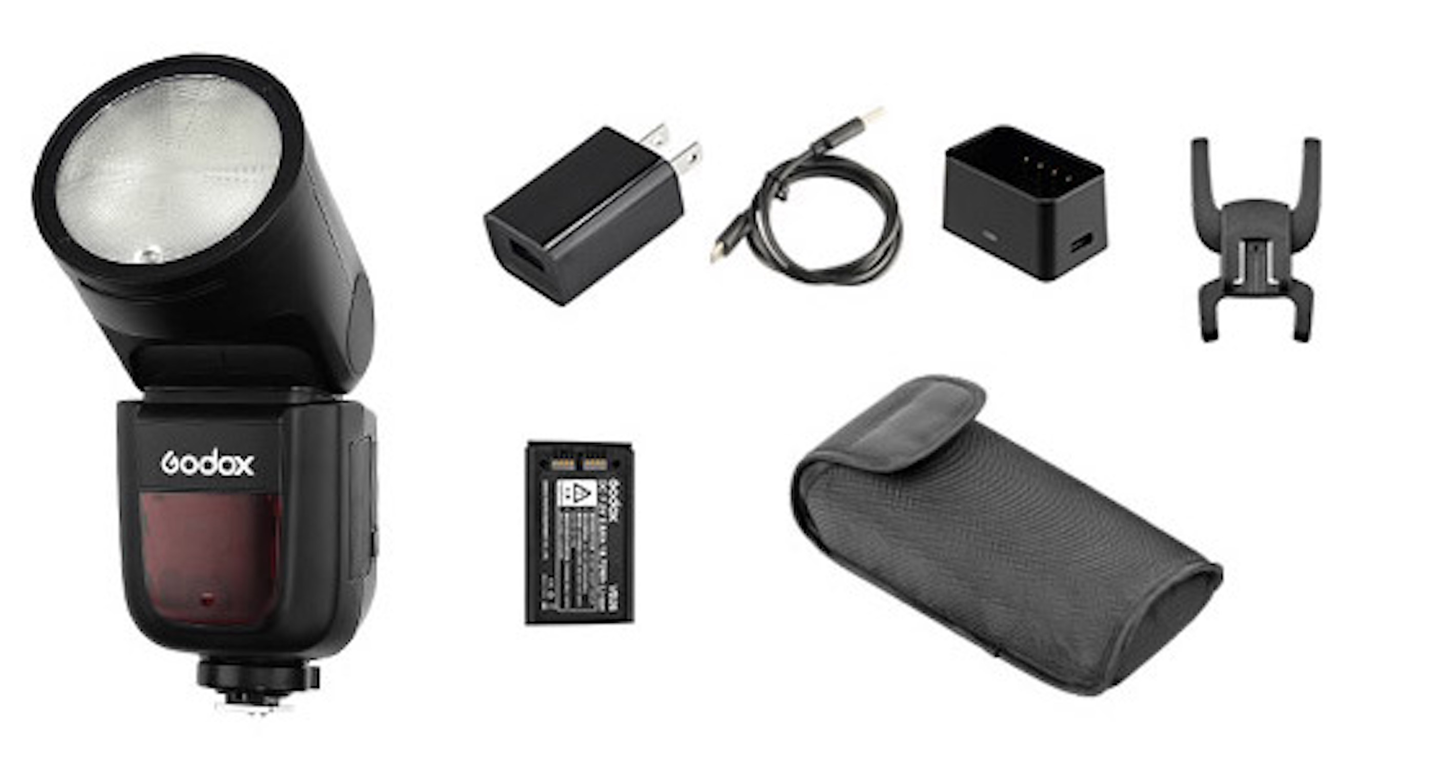 Lampa błyskowa z wieloma akcesoriami: ładowarka, kabel, bateria i etui.